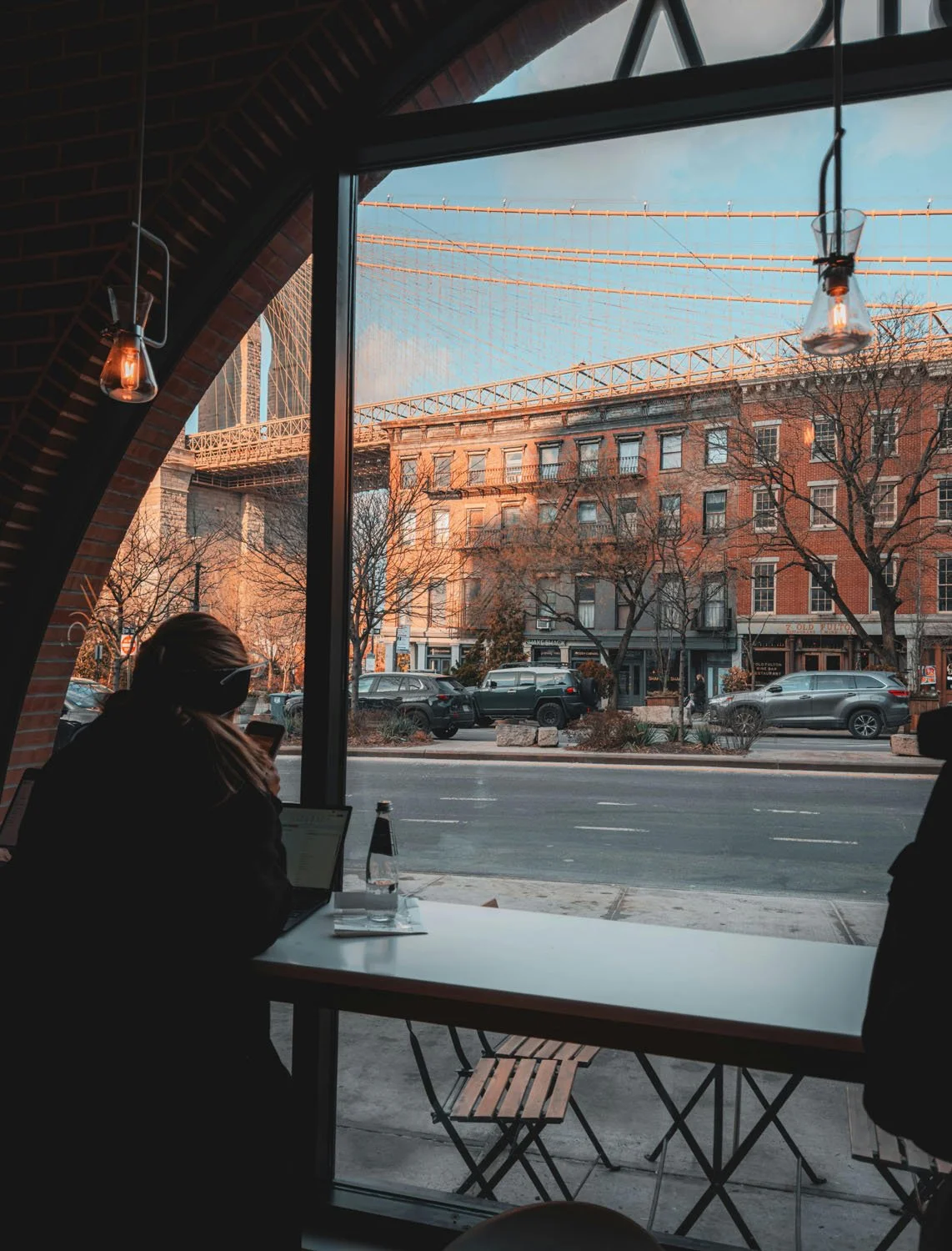 Girl working at a coffee shop in a city