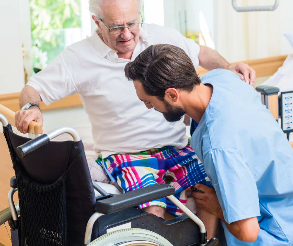 A young nurse smiling and talking with an elderly woman in a cozy home setting near a window with fruit on the counter