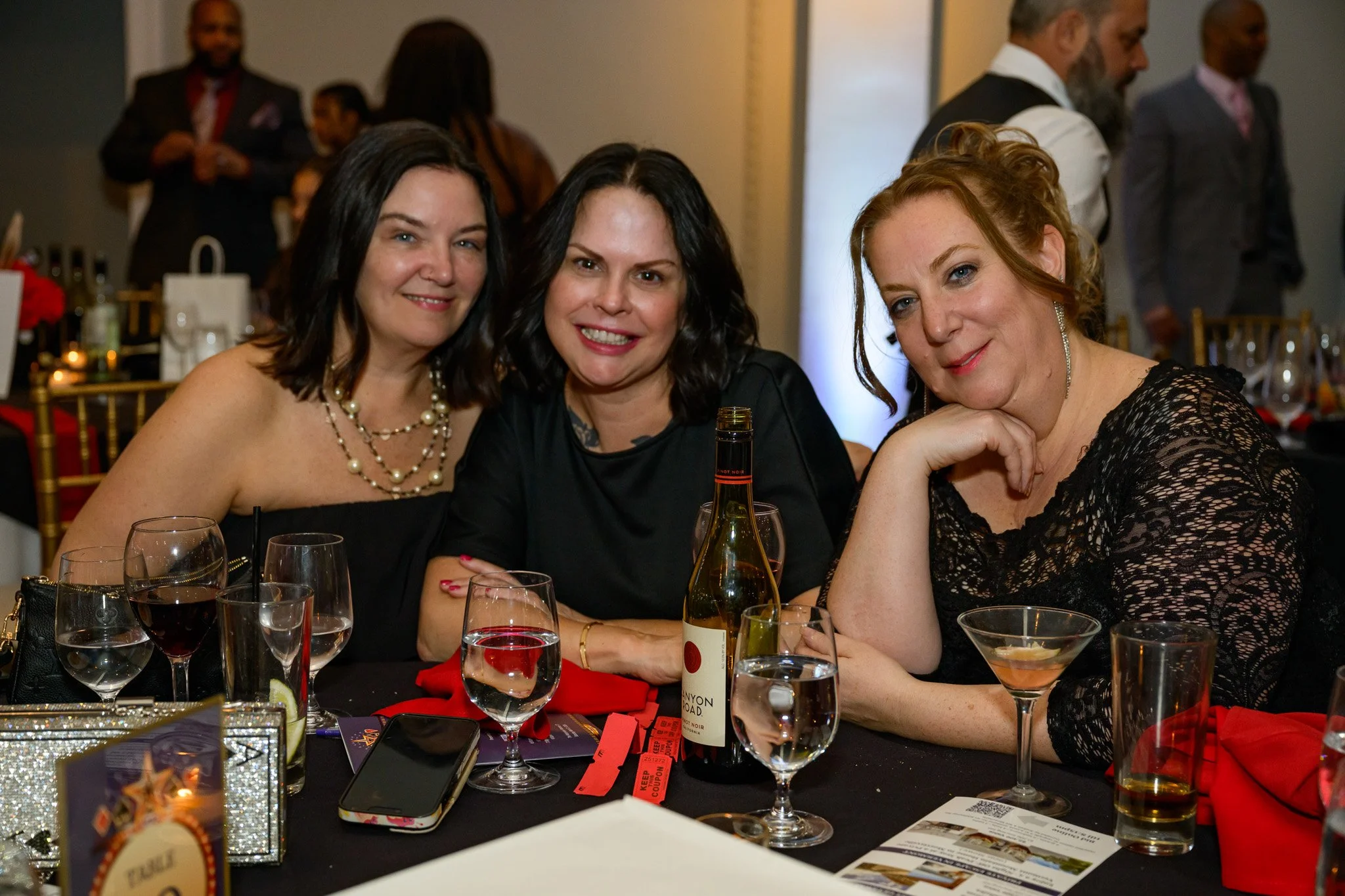 2026 Gala three Ladies at table.jpg