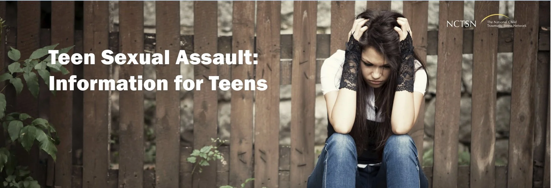 A young girl sitting on the ground with her elbows on her knees, holding her head with her hands, looking distressed and upset, next to a wooden fence and some greenery. Overlaid text reads 'Teen Sexual Assault: Information for Teens'.