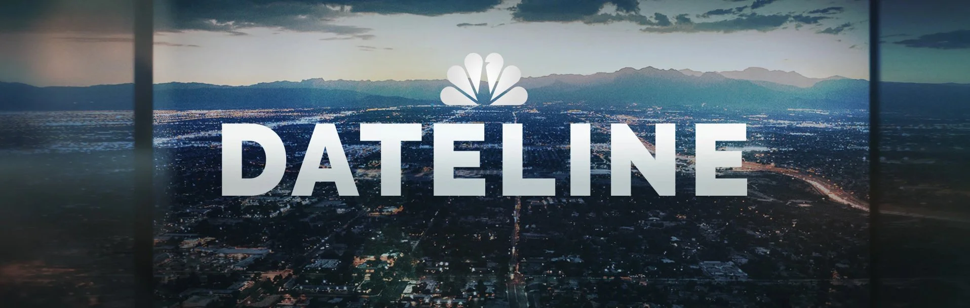 Nighttime aerial view of a city with mountains in the background, with on-screen overlay text that says "DATELINE" and a peacock logo above it.