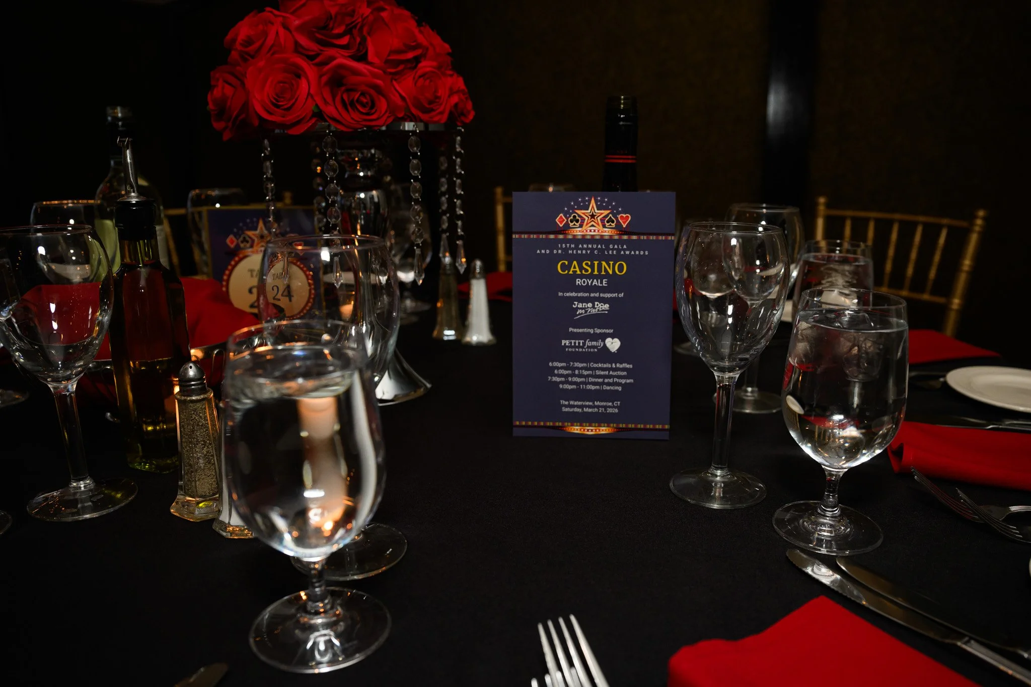 2026 Gala Brochure on table with roses.jpg