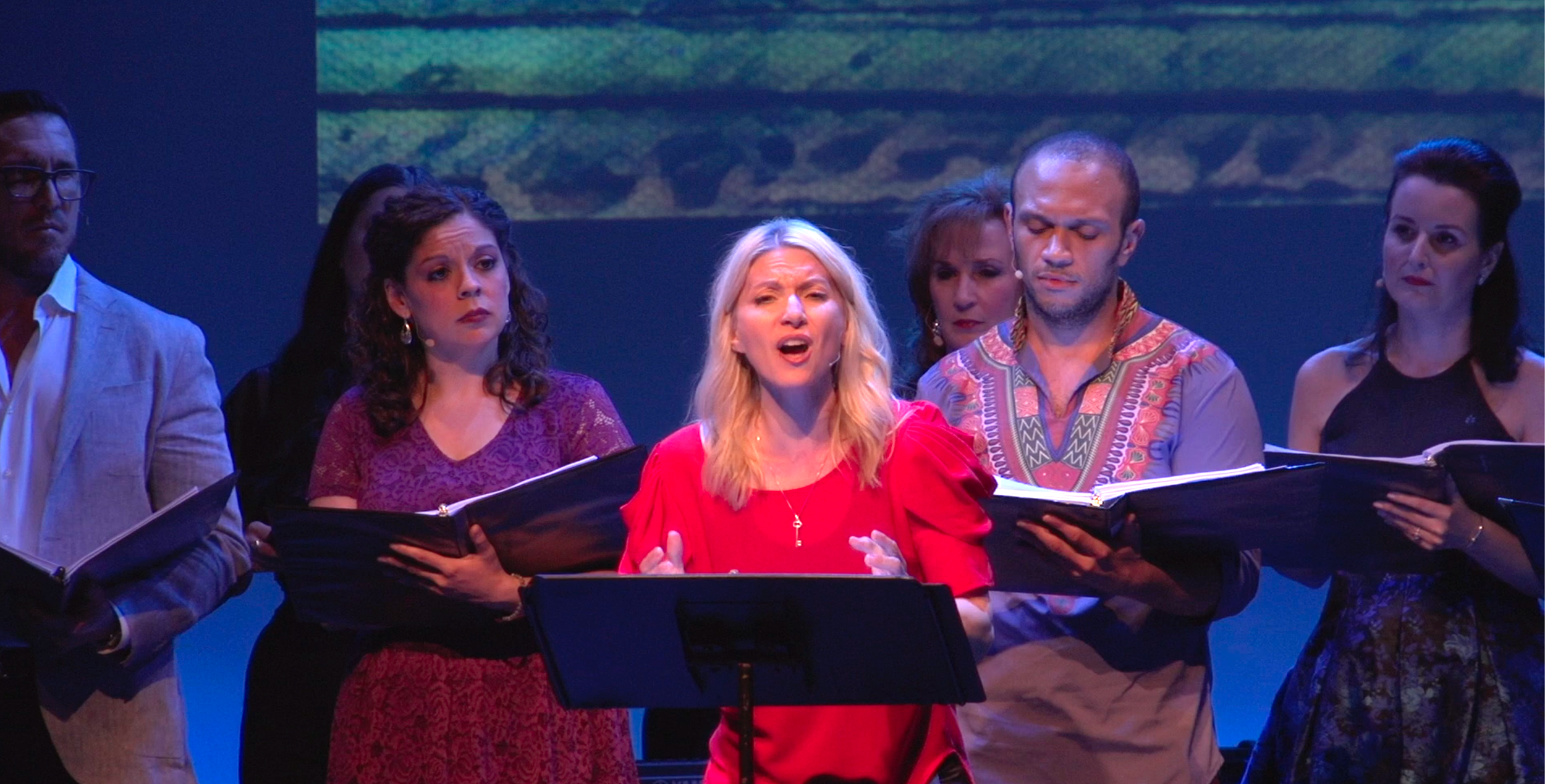 girl in red singing.png