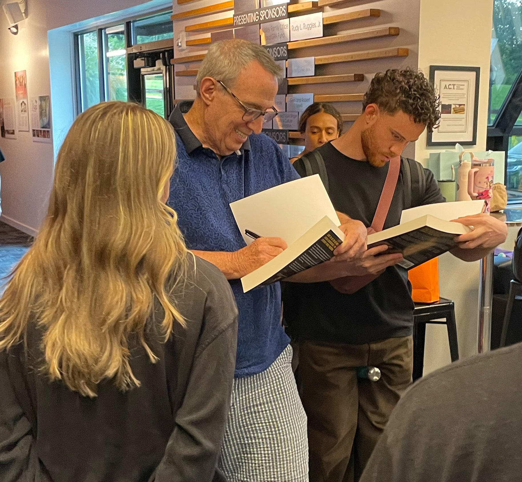 David Signing book ACT lobby.jpg
