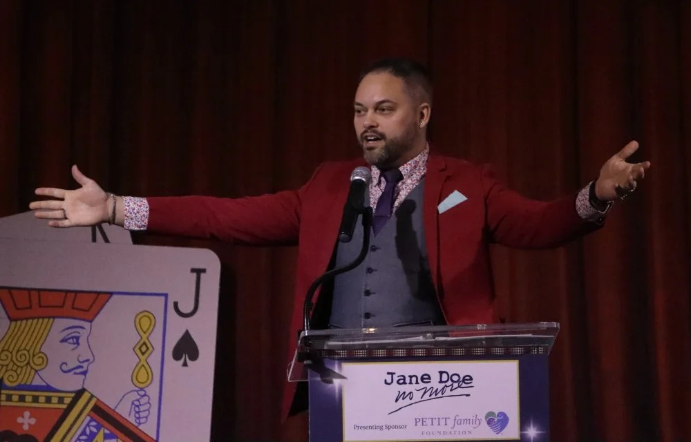 2026 Gala James Higgins arms open at podium.JPG