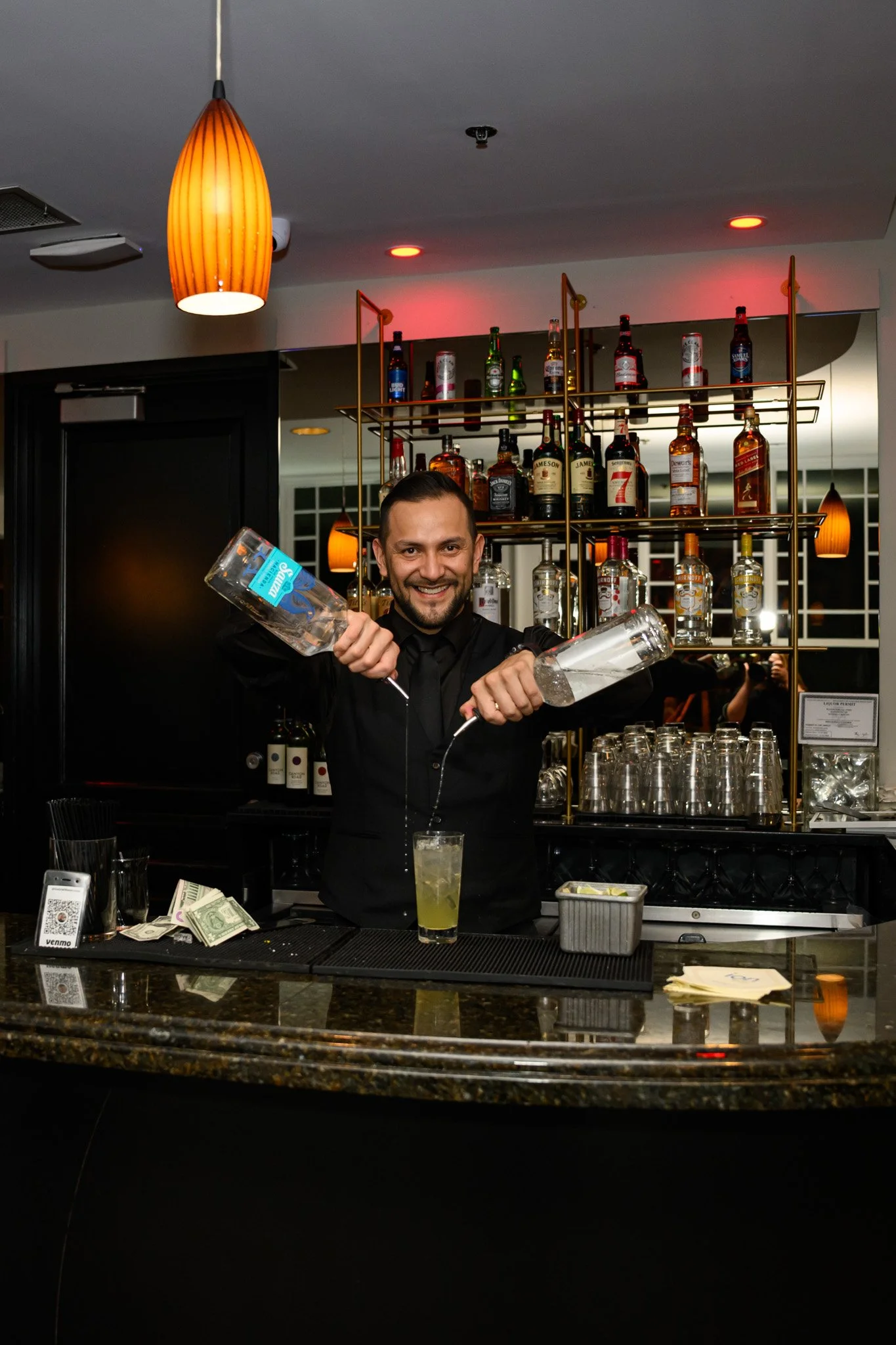 2026 Gala Bartender Mixing Drink.jpg