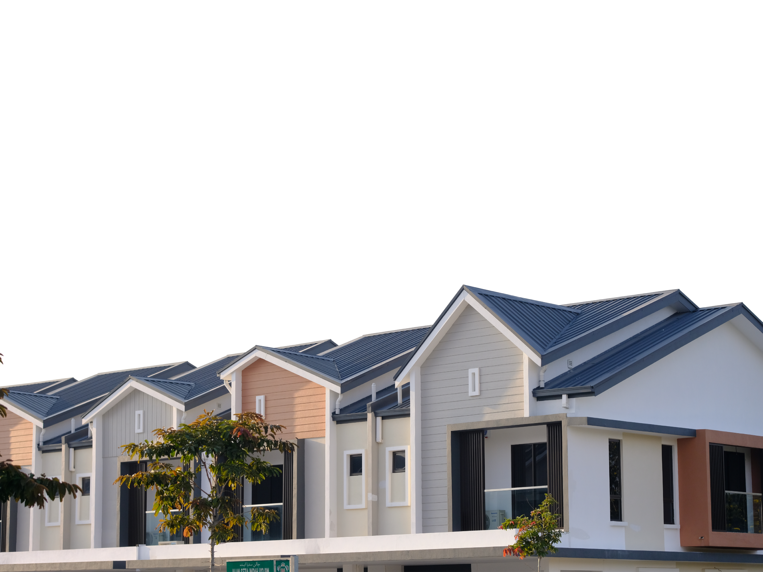 Modern residential buildings with gabled roofs, windows, and small trees in front.