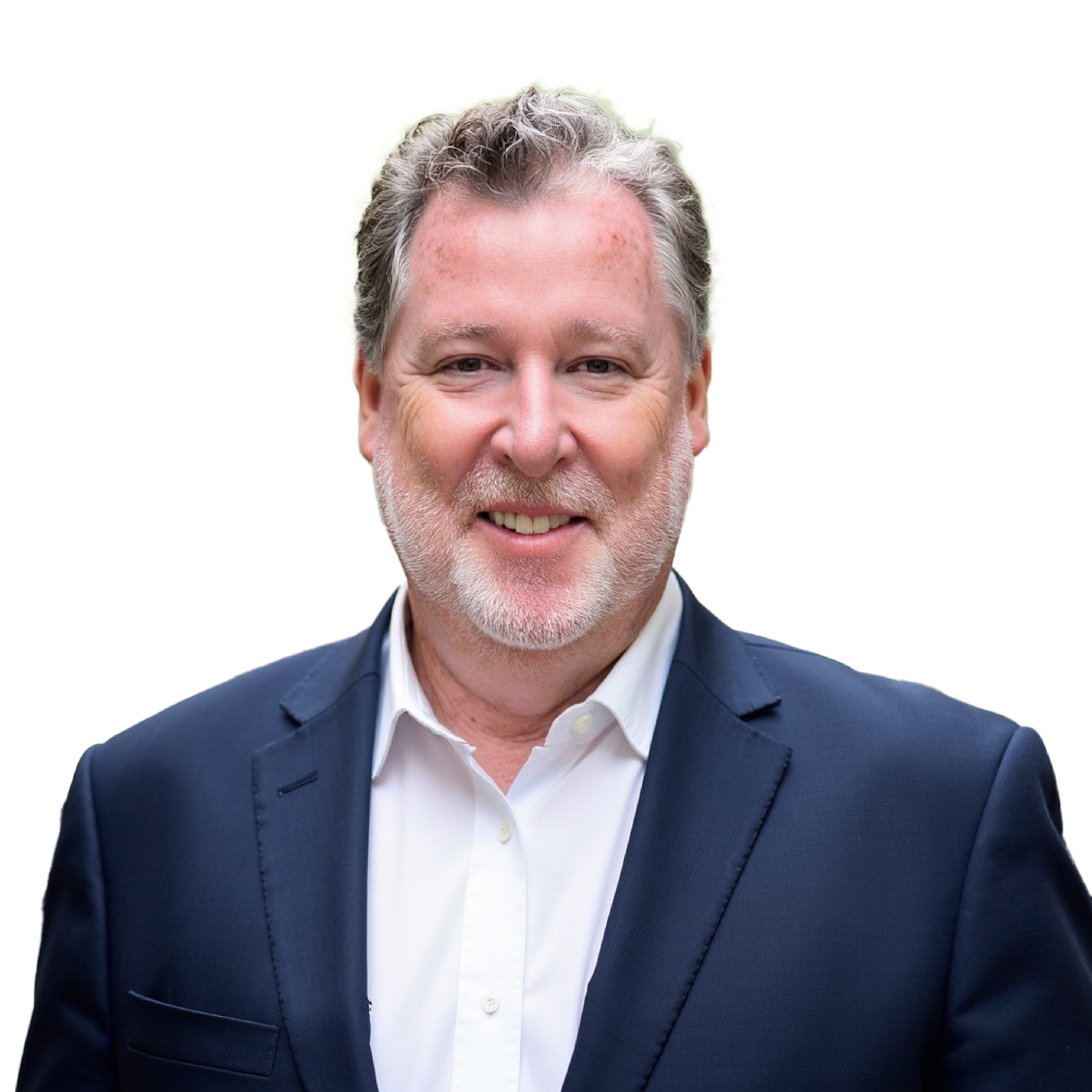 Portrait of a middle-aged man with gray hair and beard, wearing a dark suit and white shirt, smiling.