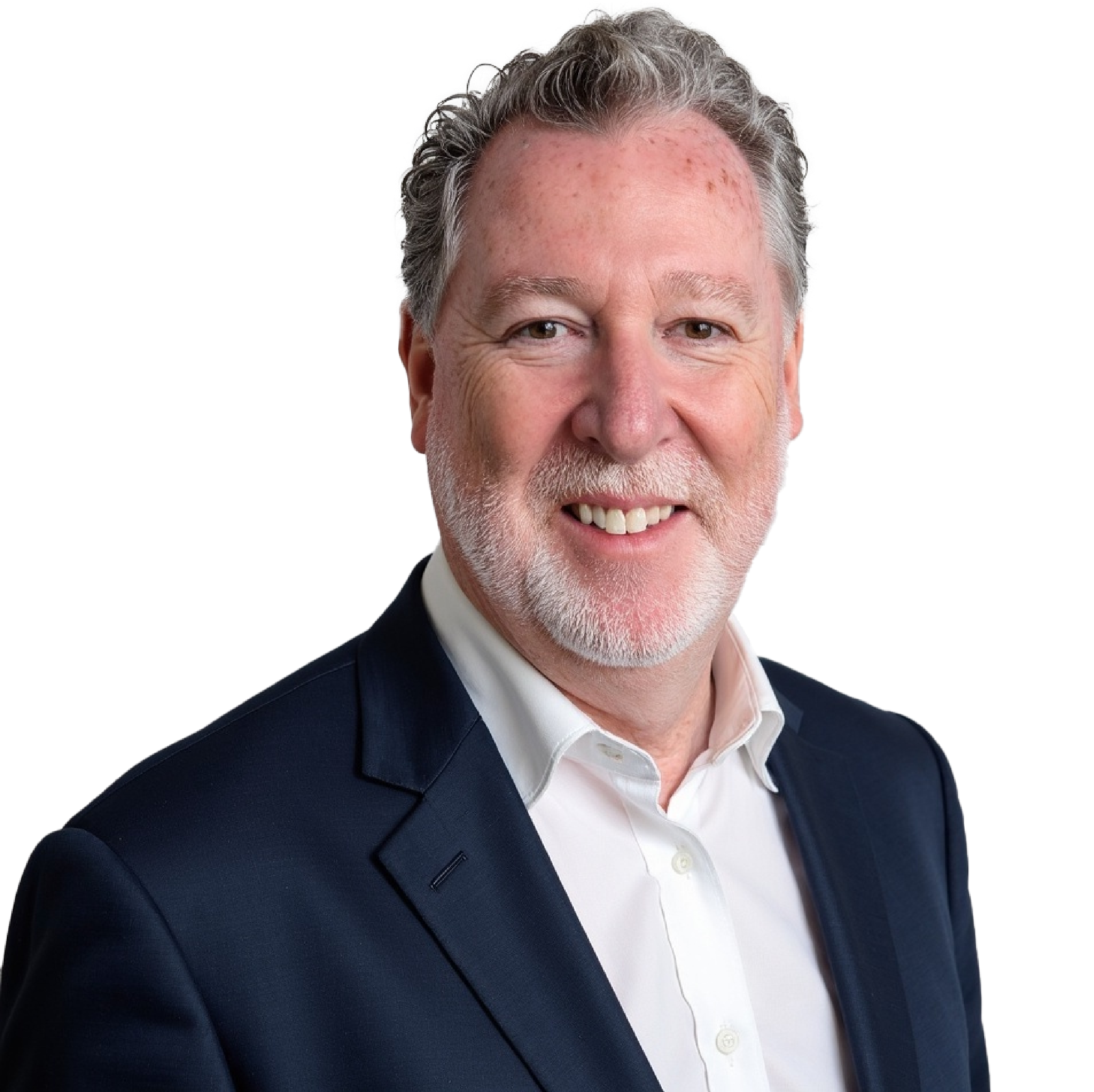 A headshot of a smiling middle-aged man with light skin, gray hair, and a beard, wearing a navy blue suit and a white shirt.