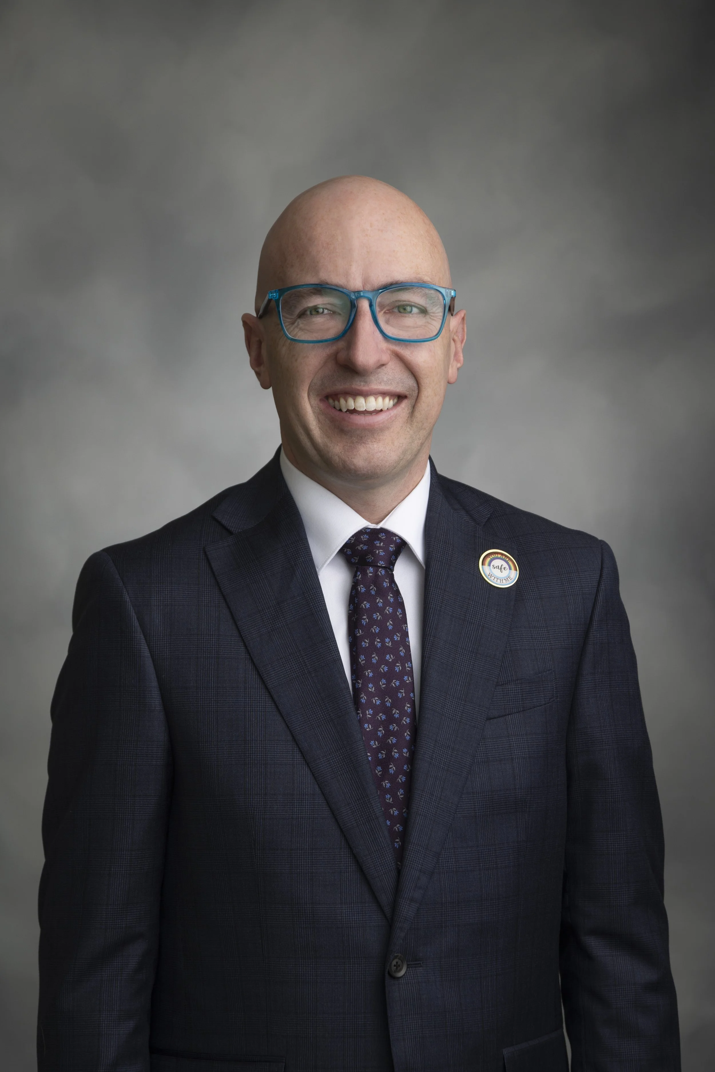 Edmonton's Mayor Andrew Knack in front of a neutral gray background.