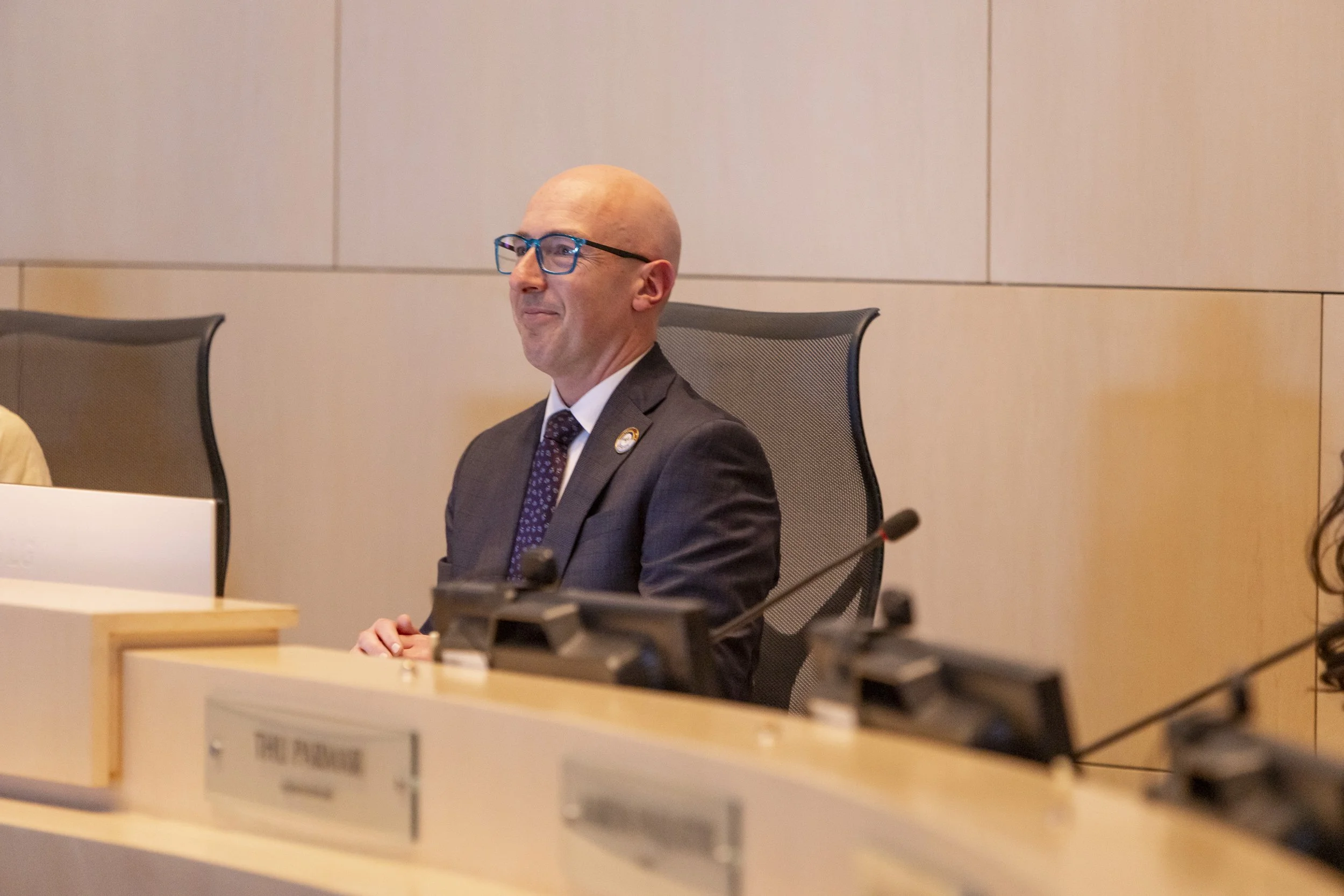 Edmonton's Mayor Andrew Knack sitting in the Mayor's chair in City Council Chambers.