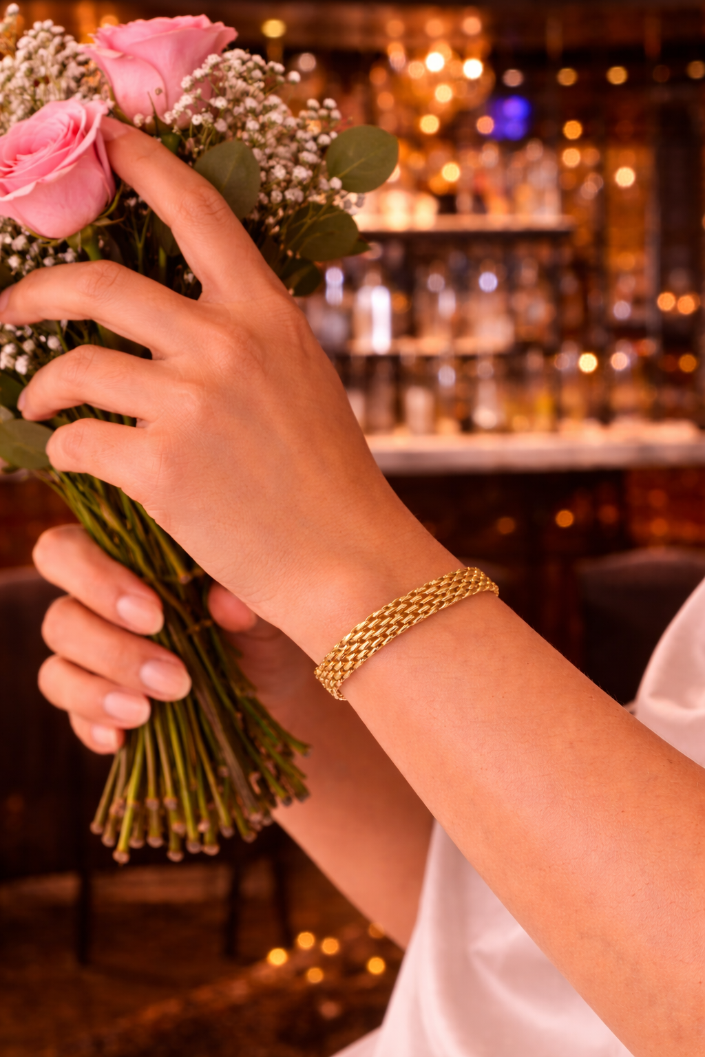 Elegant bracelet and pink roses.png
