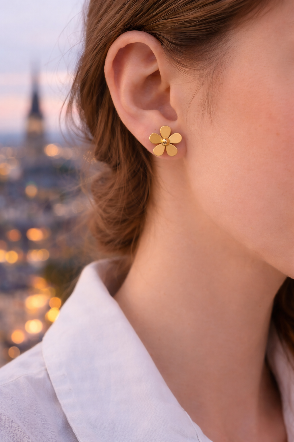 Golden flower earring at twilight.png