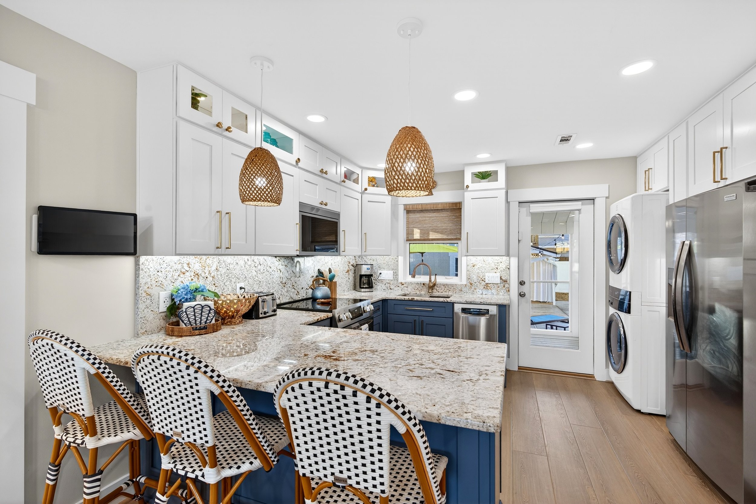 Modern beach house kitchen in Oak Island photographed for property marketing.