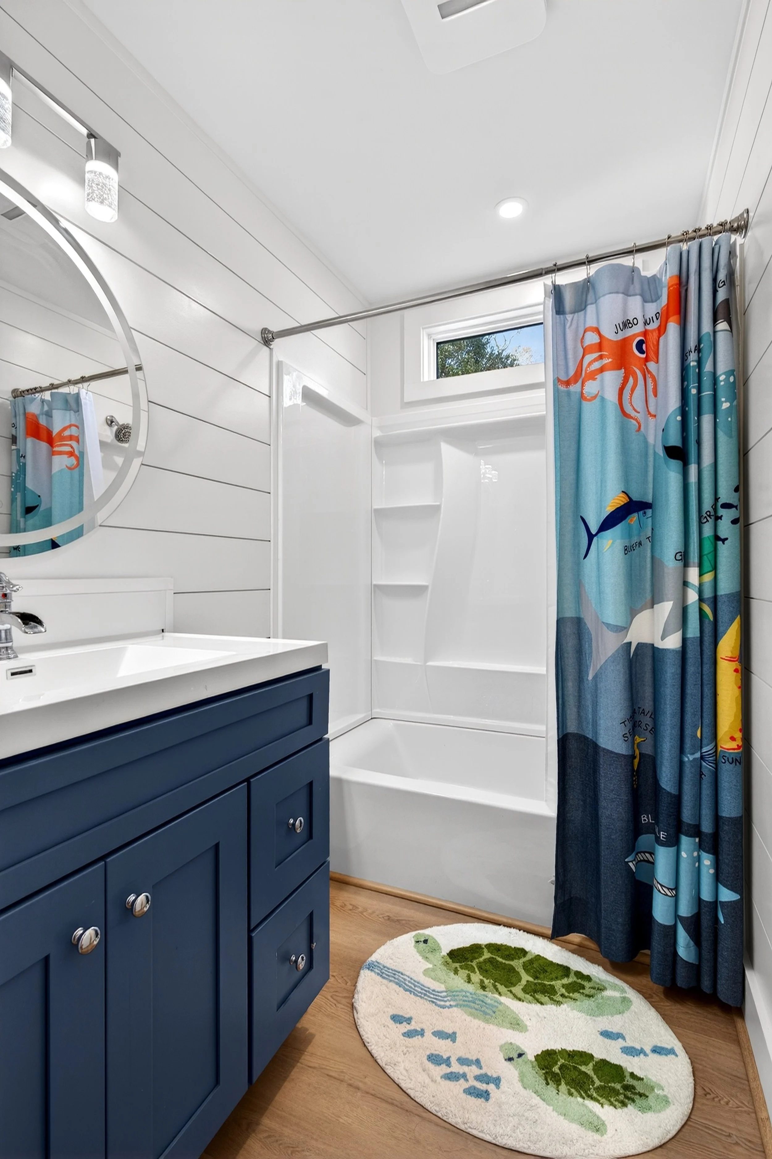 Clean modern bathroom interior photographed for Oak Island real estate listing