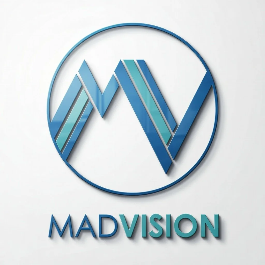 A modern, blue and teal logo with overlapping lines forming a stylized letters 'M V' inside a circular frame, with the word 'MADVISION' below.