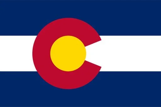 The Colorado state flag with a large red 'C' and a yellow circle inside it, on horizontal blue and white stripes.