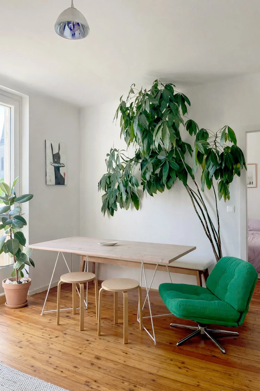 Apartment interior with dining area and greenery