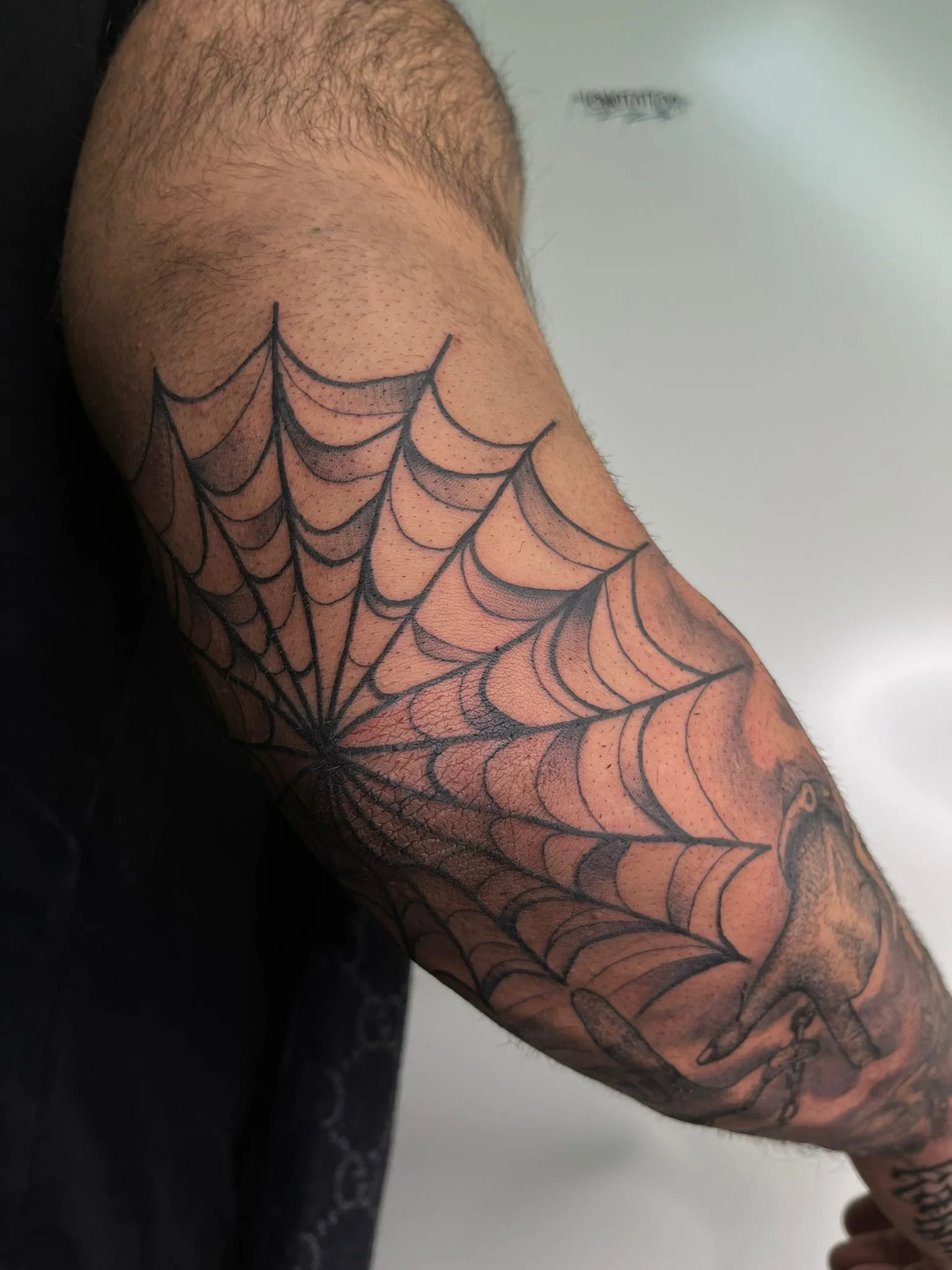 Traditional Black and Grey Spider Web Elbow Tattoo Done By LonoTattoo