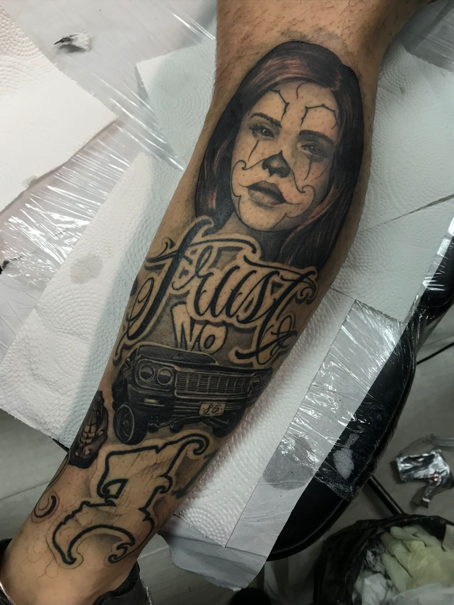 Chicano Black and Grey Lettering Low Rider and Palhaca Arm Tattoo Done By LonoTattoo