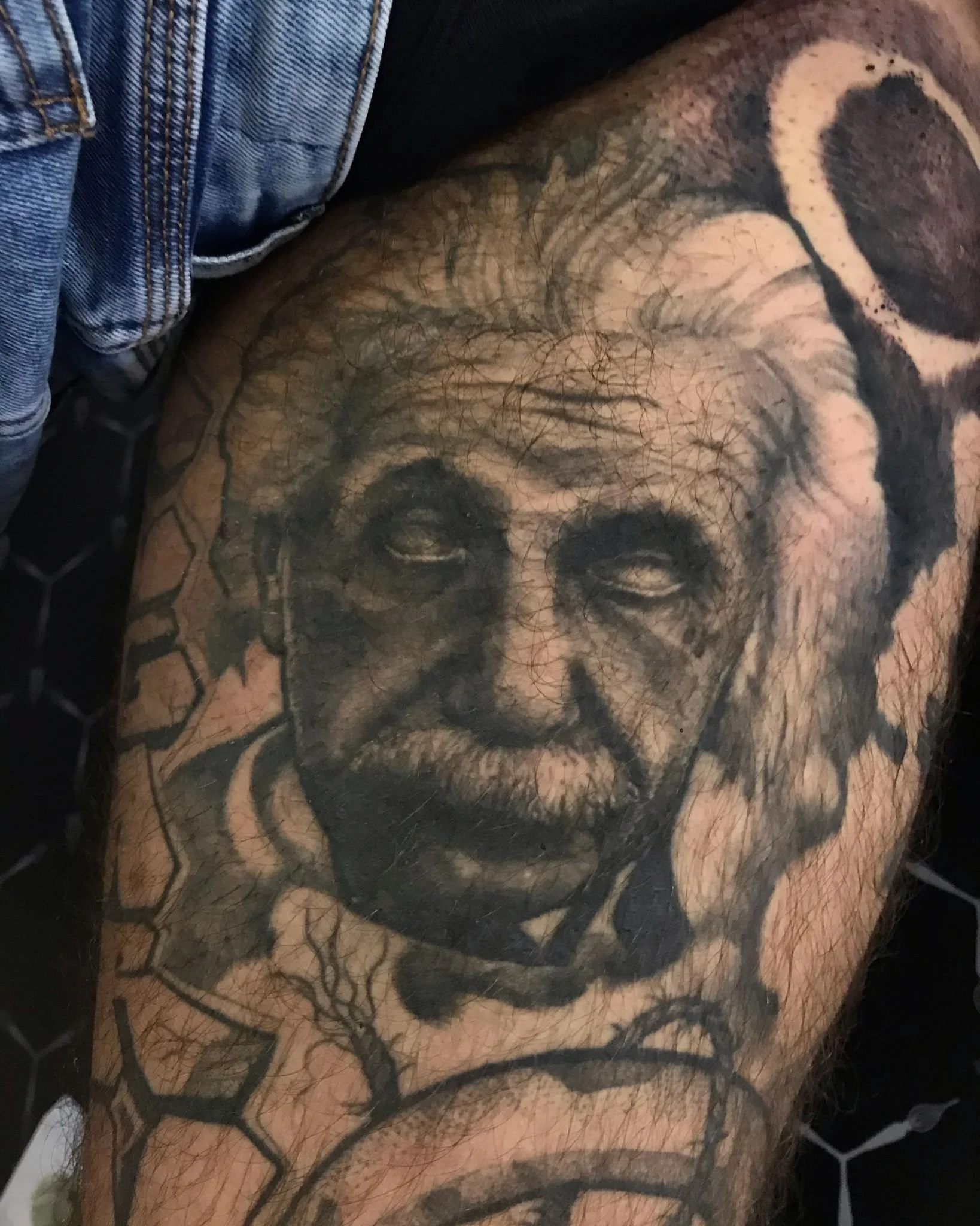 Realisic Black and Grey Dark Einstein Portrait Healed Leg Tattoo Done By LonoTattoo