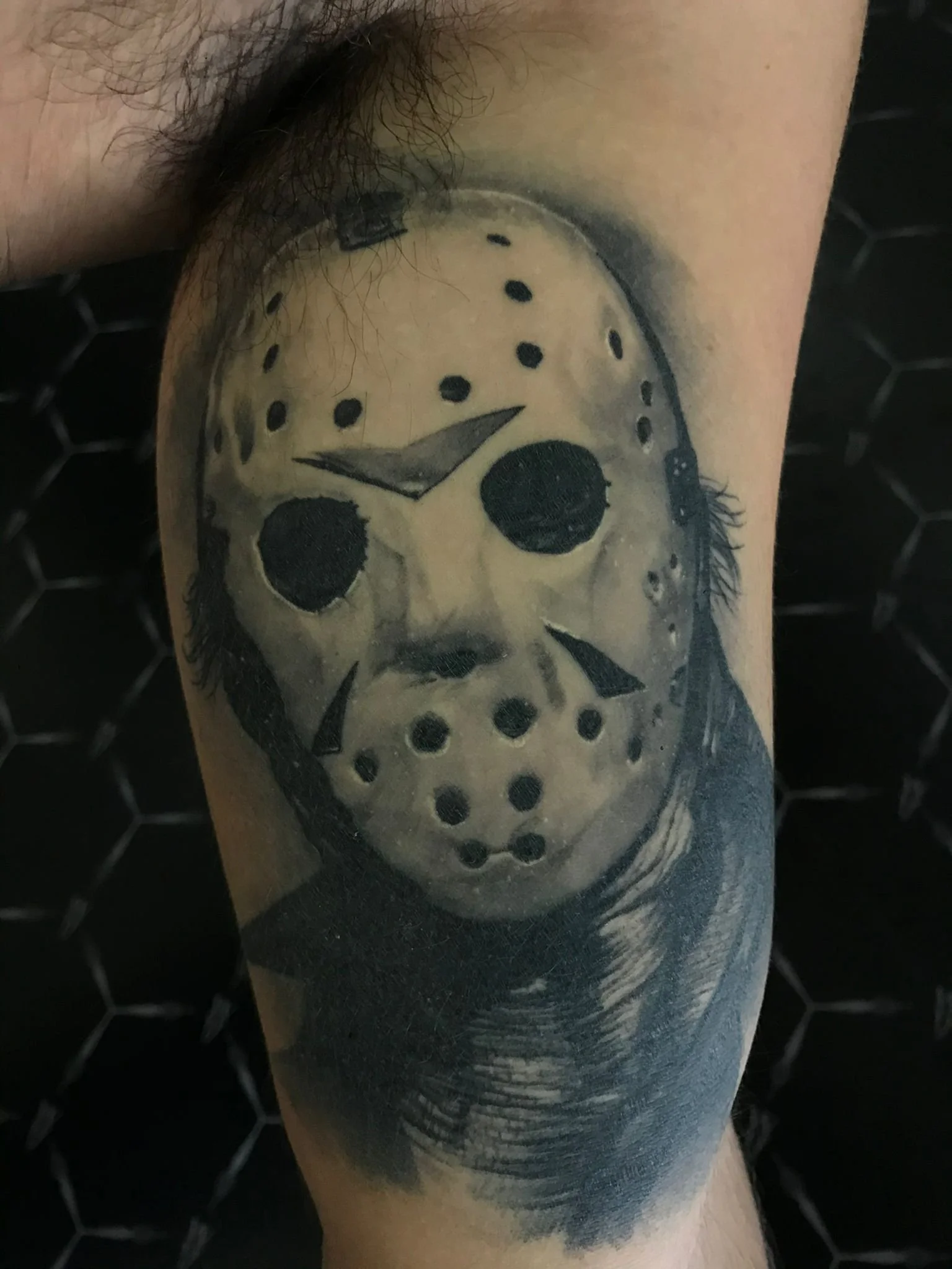 Realisic Black and Grey Jason Horror Healed Arm Tattoo Done By LonoTattoo