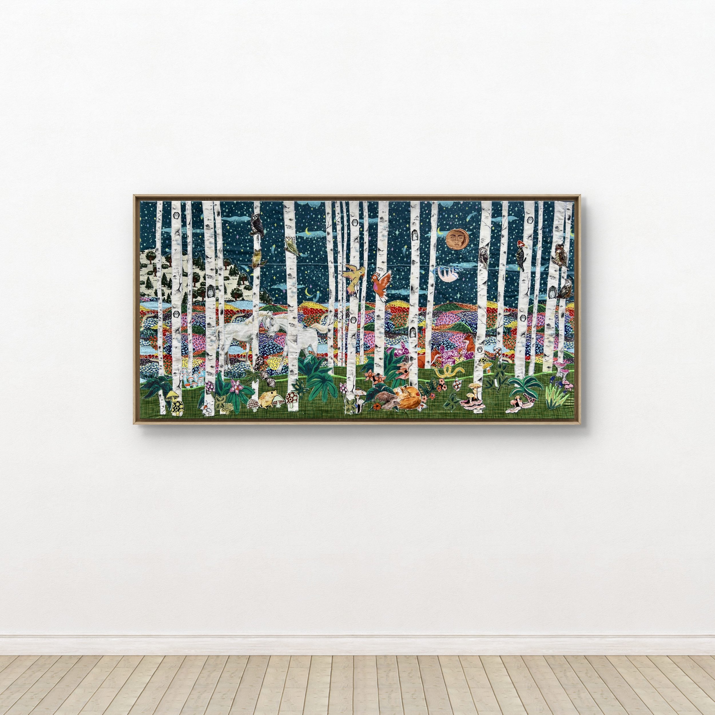 A colorful textile collage depicting a forest scene with tall white birch trees, woodland animals, insects, and a starry night sky.
