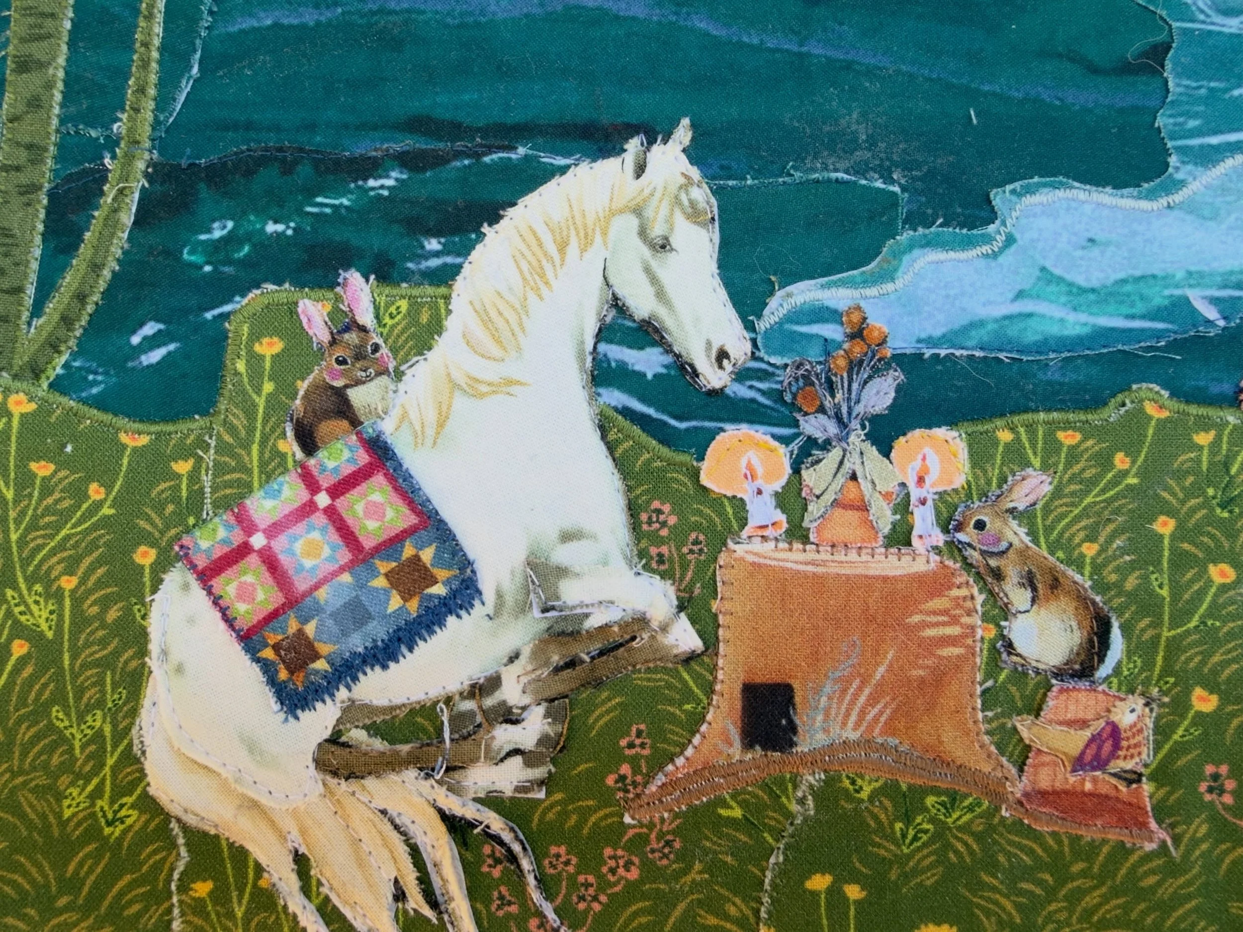 This custom collage features bunnies, dogs, horses, and of course the occasional fishing cat, and blue raccoon. I had so much fun making this one. Like always, there are a million tiny details tucked into this fabric world. ❤️🧵but the horse who is h