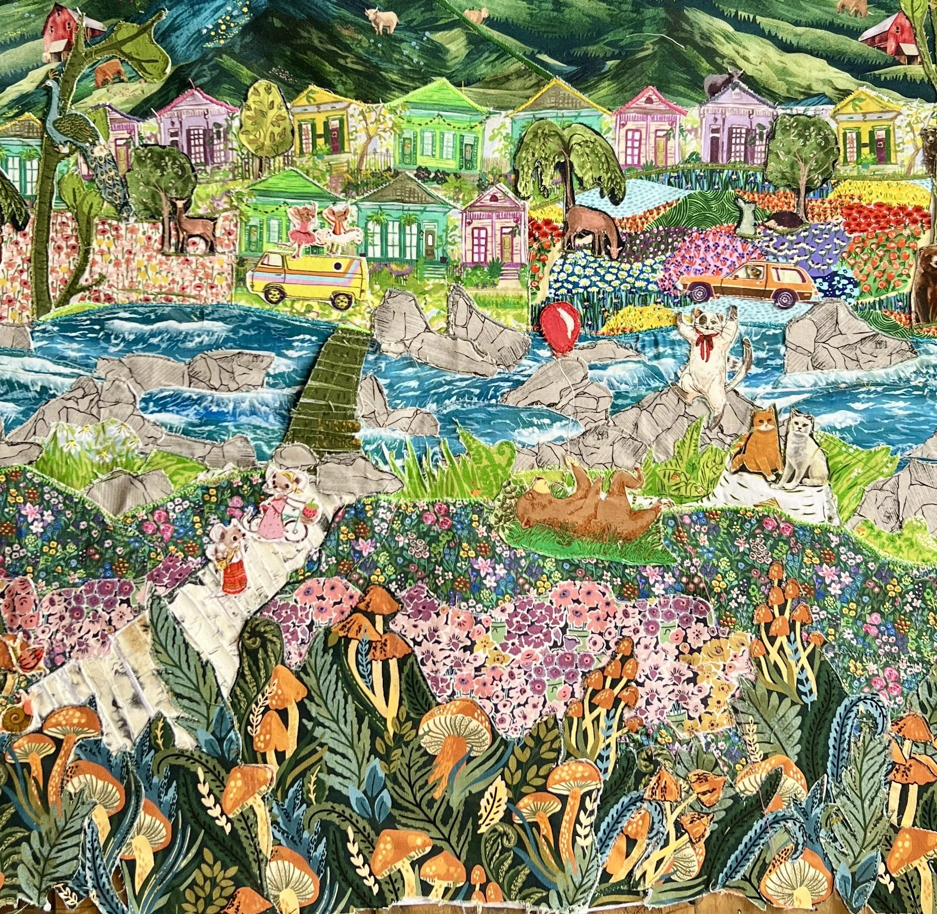 Colorful fabric collage depicting a vibrant countryside scene with houses, animals, a river with rocks, flowers, and animals including cats, dogs, and birds.