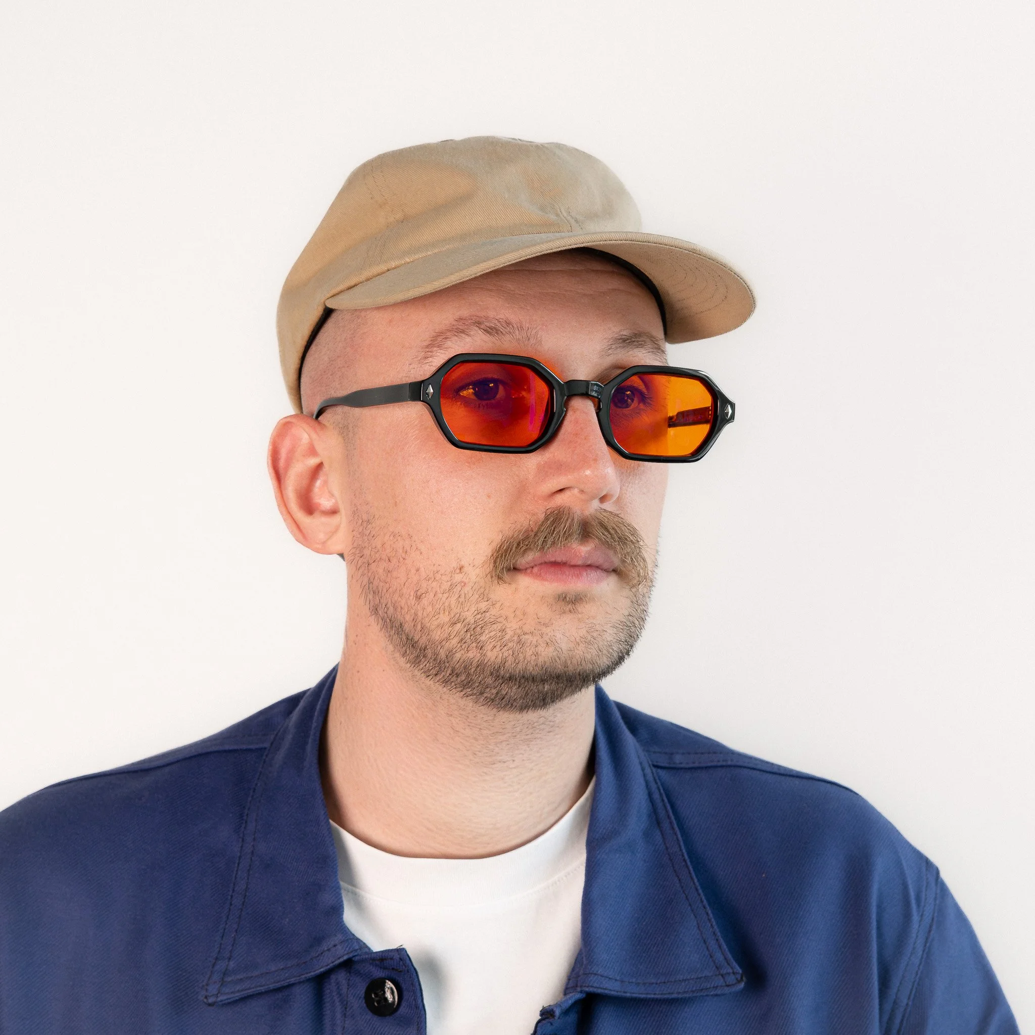 Soho blue light glasses worn side view black hexagonal frame with amber orange lenses