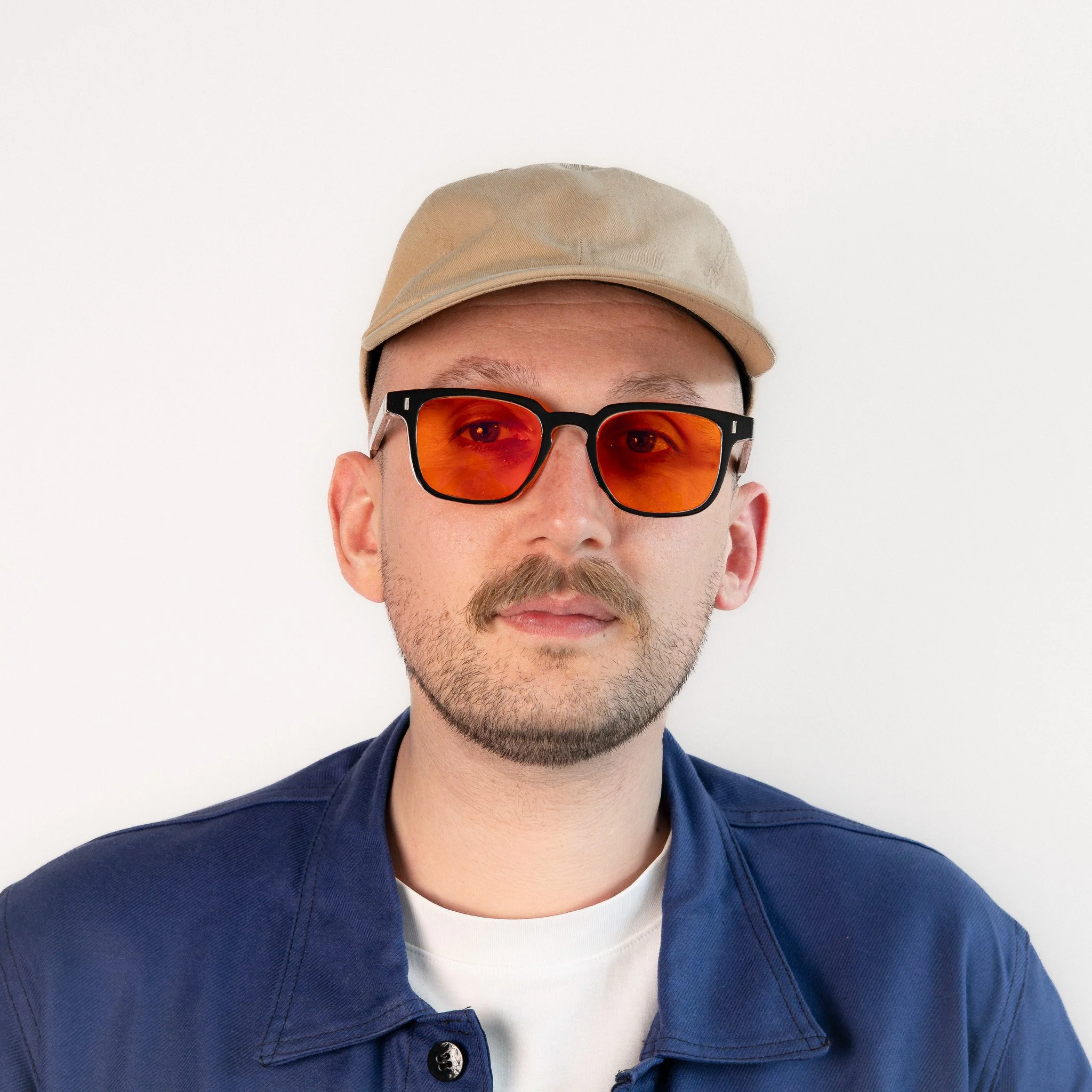 Shoreditch blue light glasses worn front view black square frame with softlight amber orange lenses.
