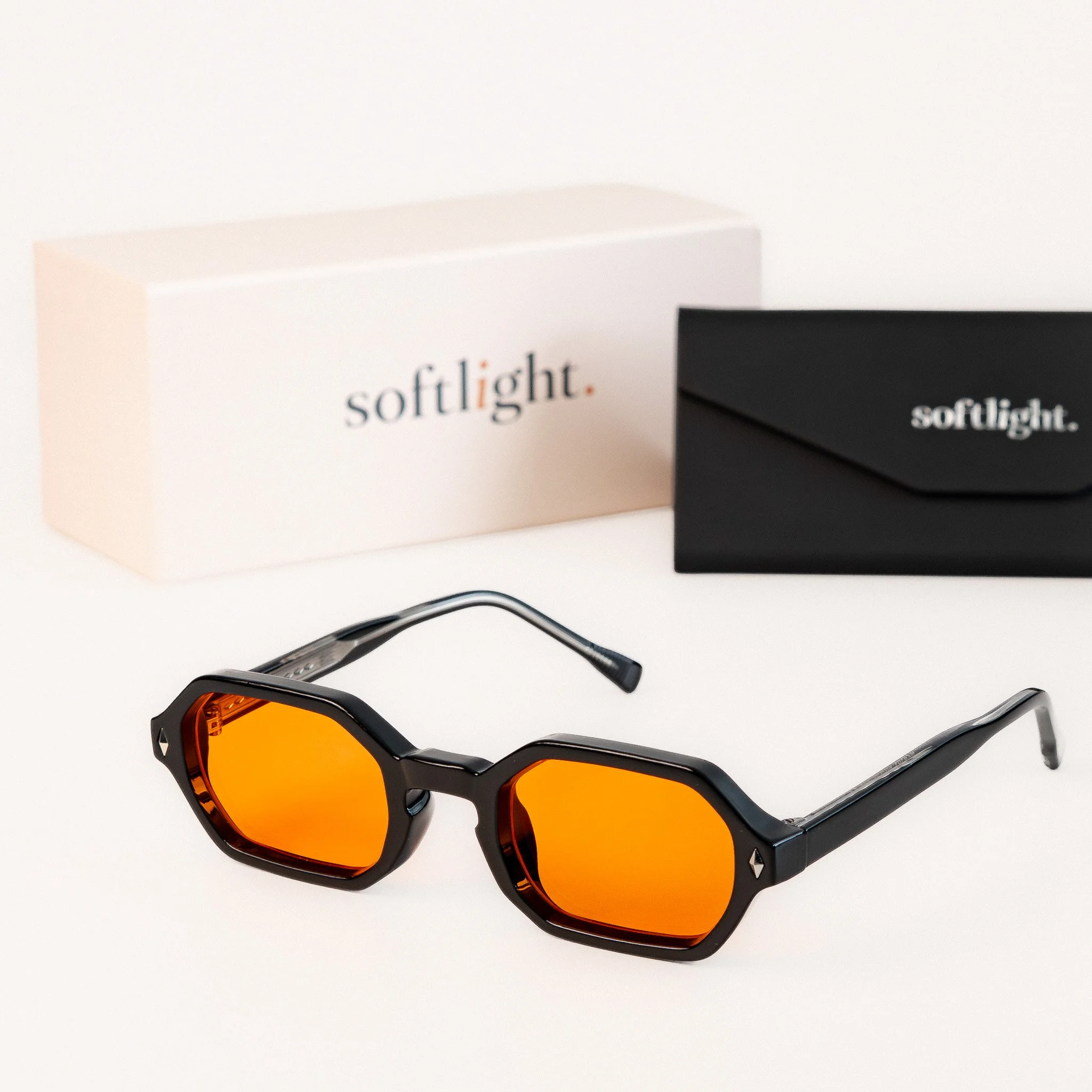 Soho blue light glasses front view black hexagonal frame with amber orange lenses with packaging