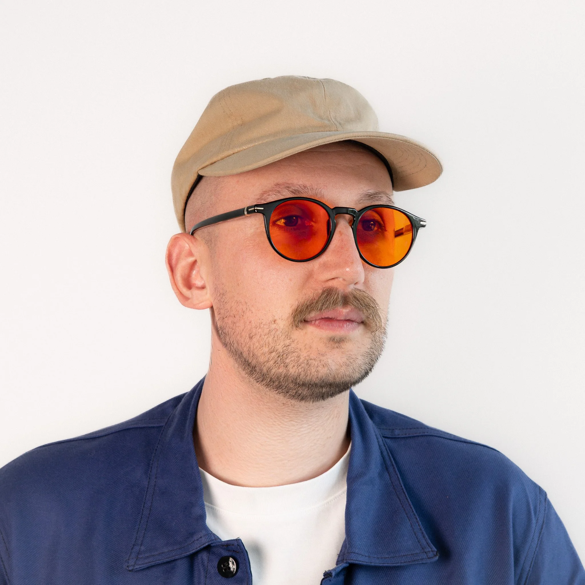 Durham blue light glasses worn side view black acetate round frame with amber orange lenses