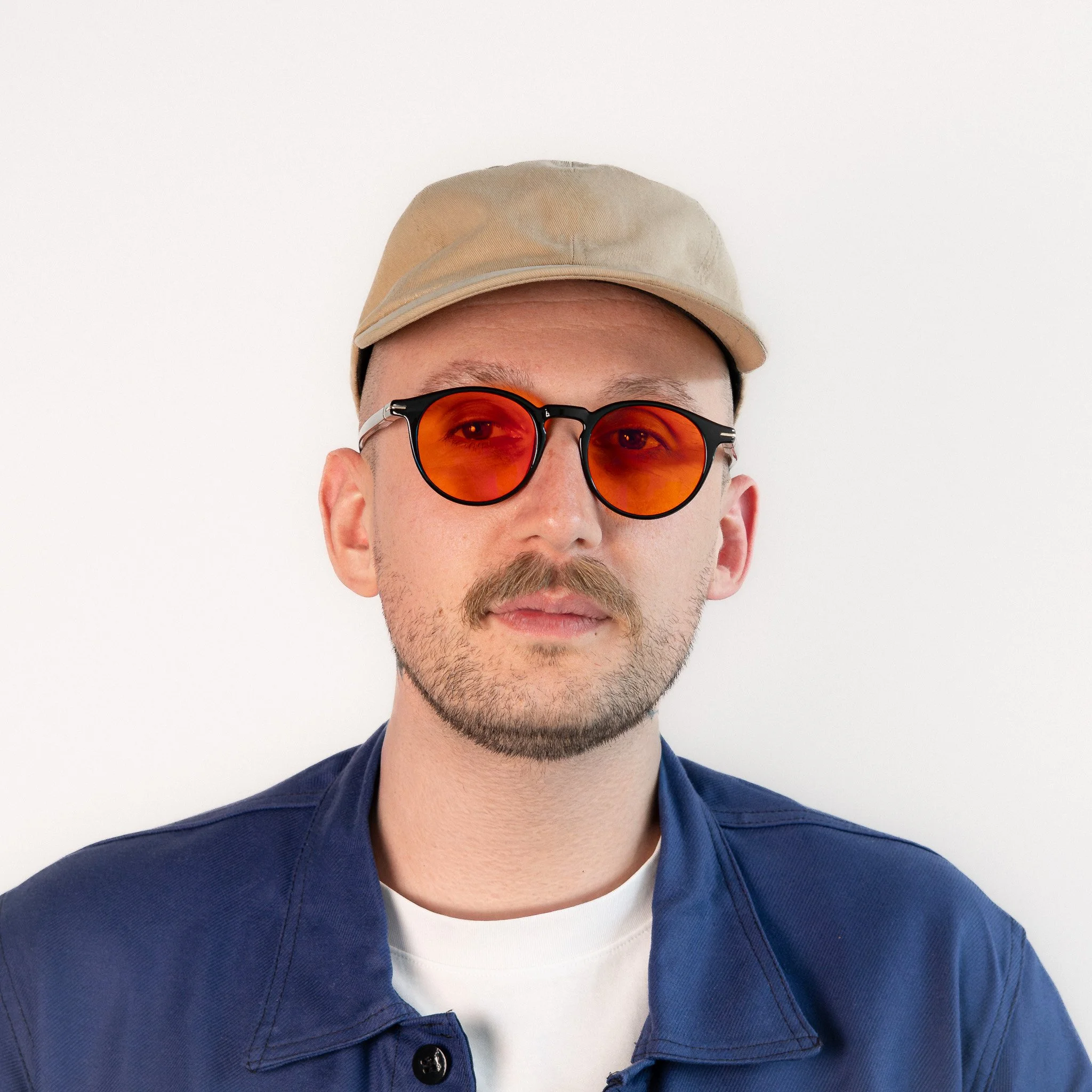 Durham blue light glasses worn front view black acetate round frame with amber orange lenses