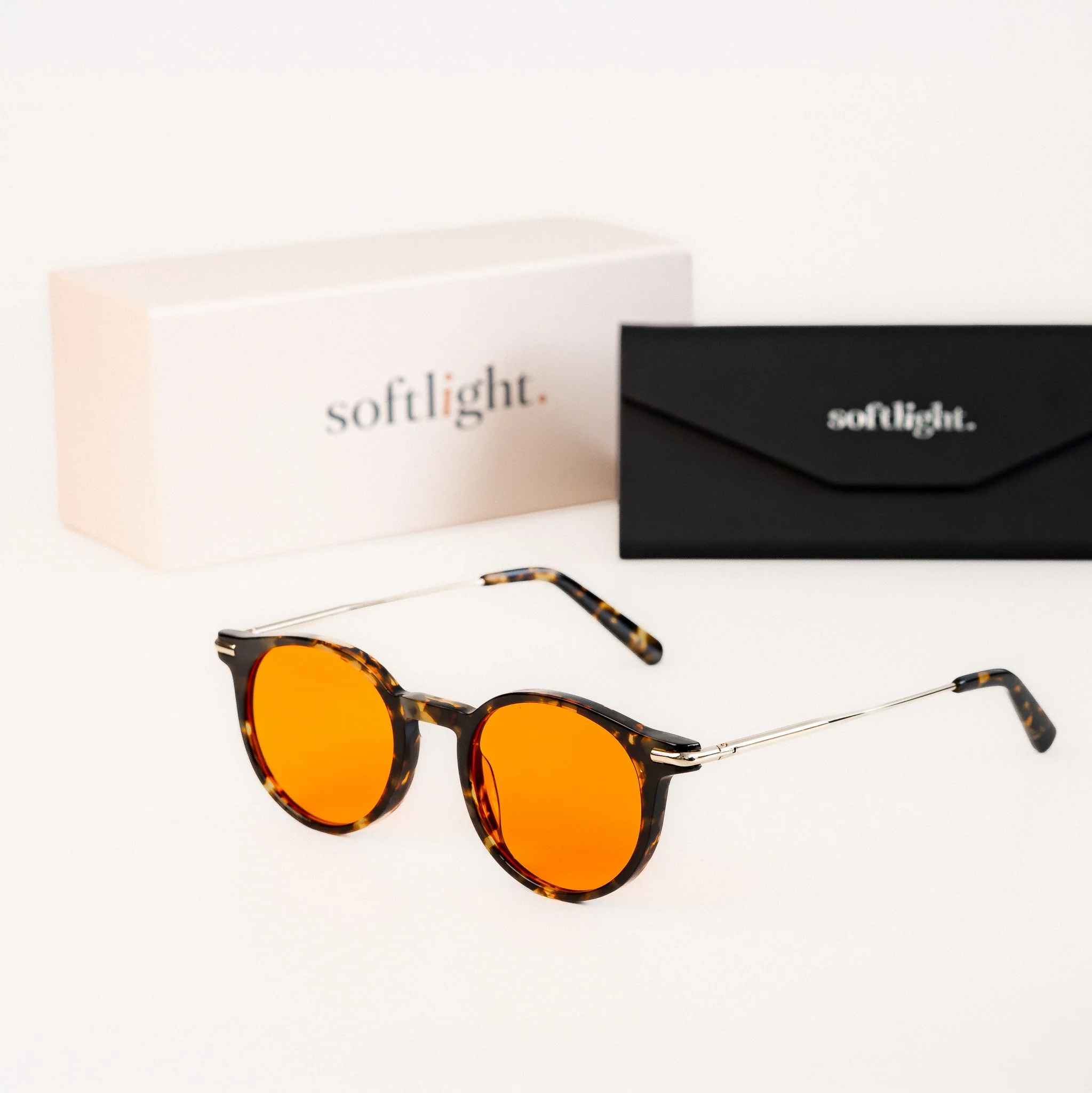 Alden blue light glasses front view tortoise acetate round frame with amber orange lenses with packaging