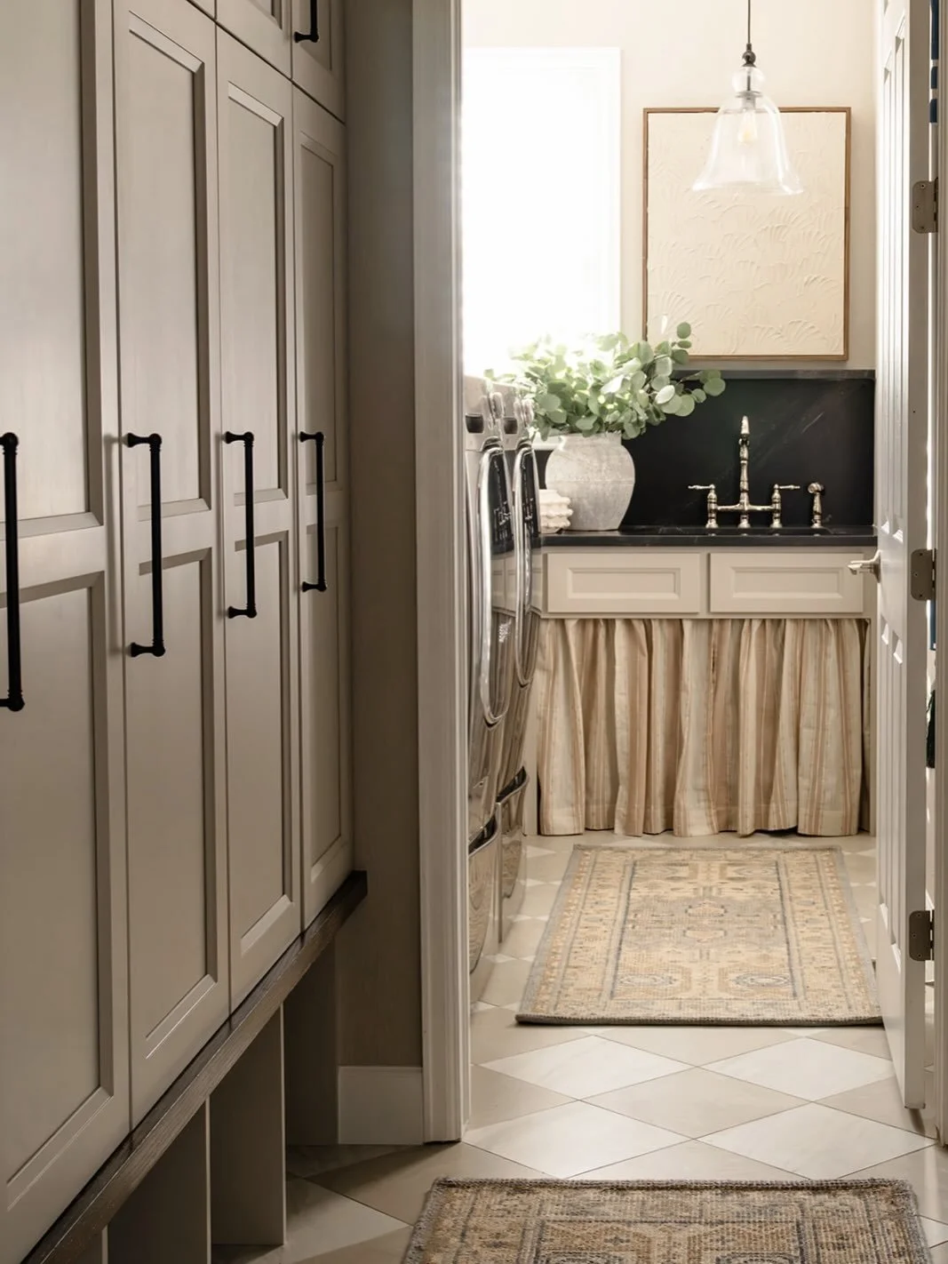 Swipe for a thoughtful refresh that reimagined a hardworking pass-through into a calm, beautiful mudroom+laundry space ✨ Same footprint, improved flow, smarter storage, and a design that supports and elevates everyday routines!

#mudroomdesign #laund