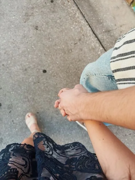 couple walking and holding hands in Boston