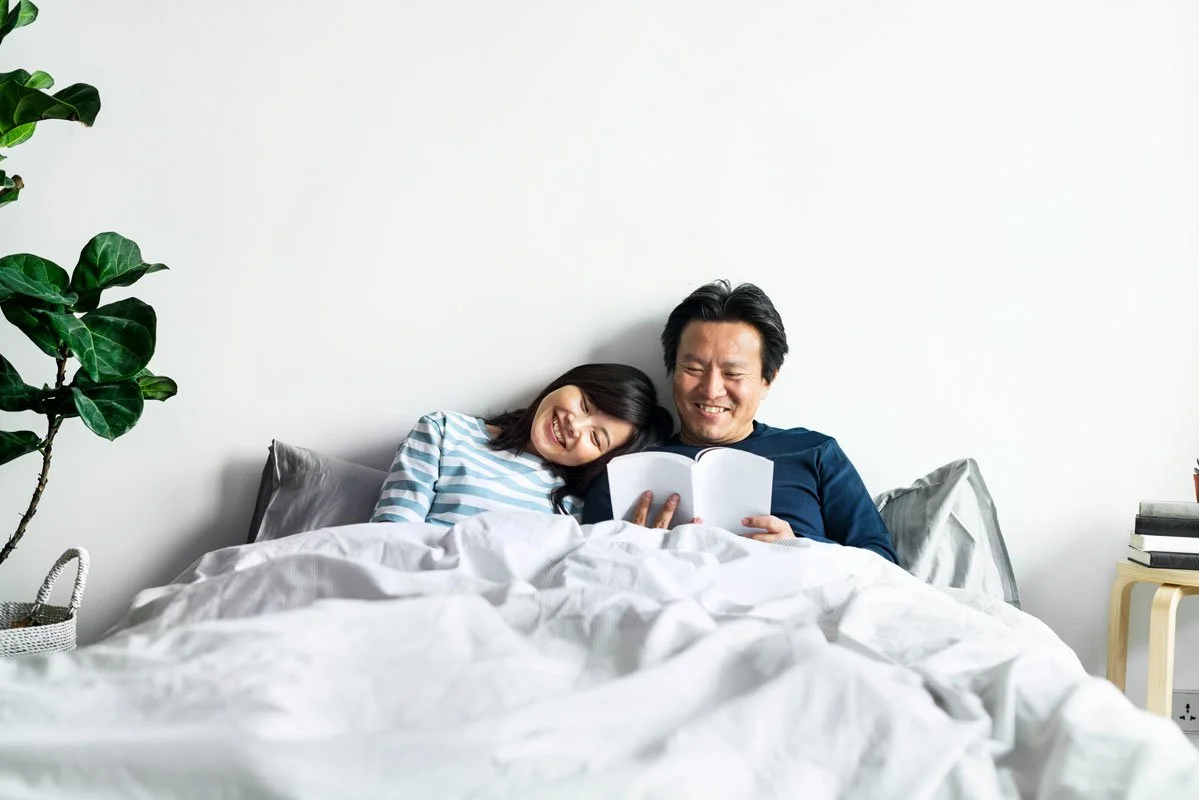 couple reading together in bed