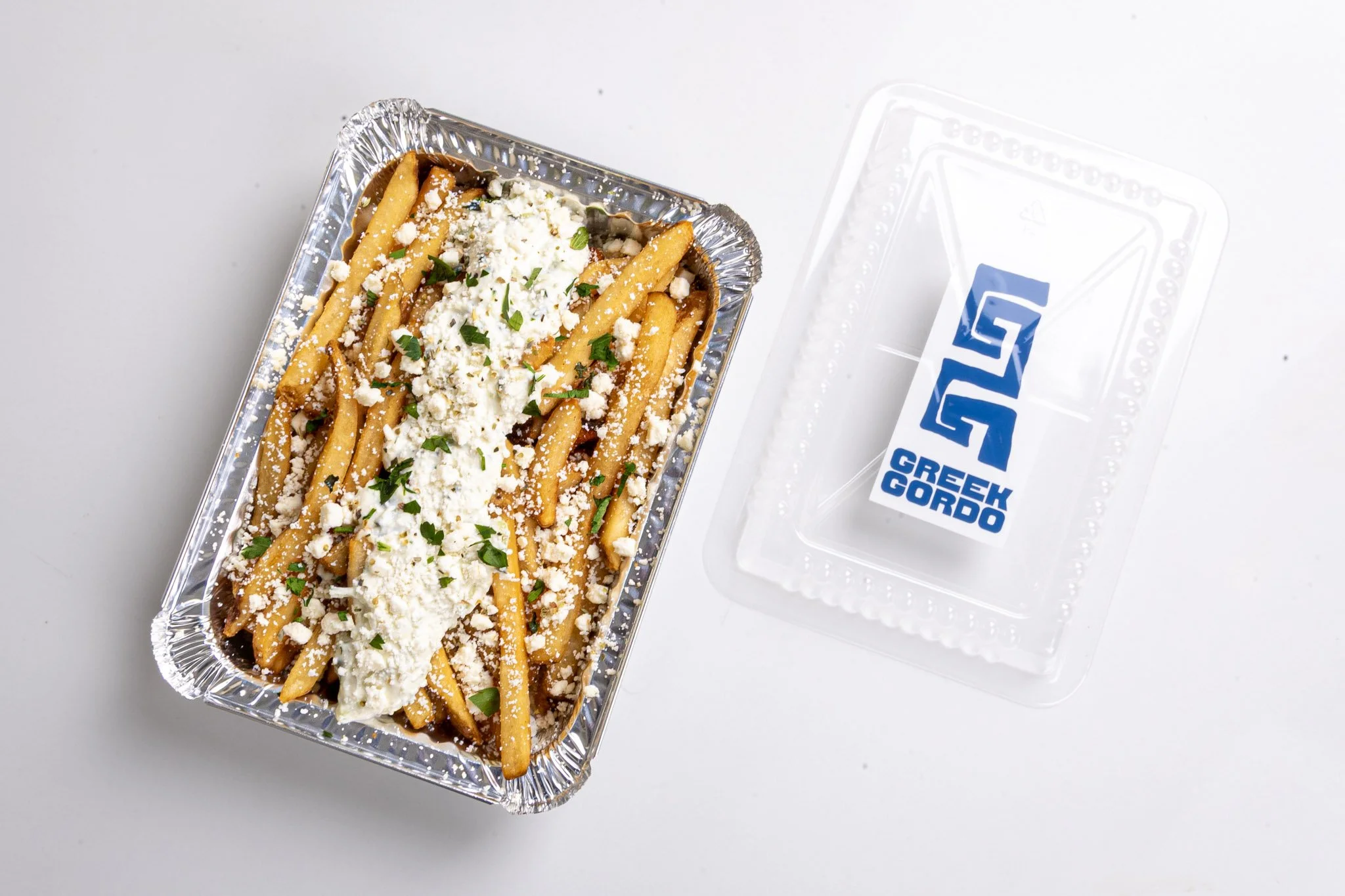 Toronto Best Greek Takeout -Greek fries topped with cheese and herbs Greek Gordo 