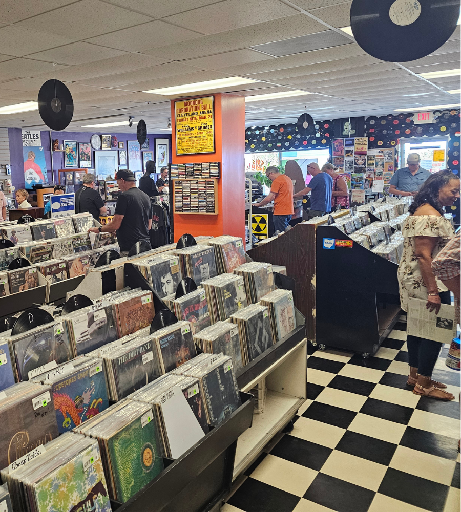 Shoppers browsing vinyl records inside a Cleveland record store during Wax & Tracks Fest