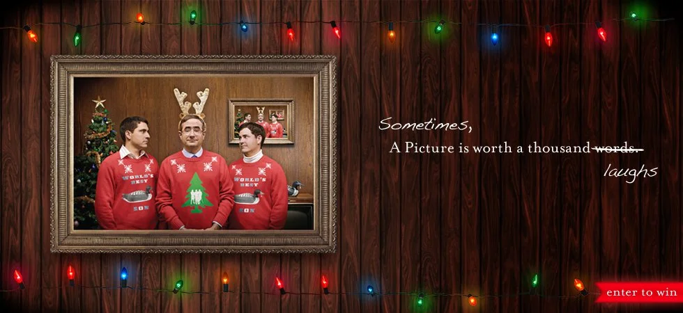 Advertisement banner for Don & Sons Wine Company. Three men wearing matching Christmas sweaters with reindeer and Christmas tree designs, standing in front of a Christmas tree and a wall-mounted framed photo of two people, with holiday lights and a w