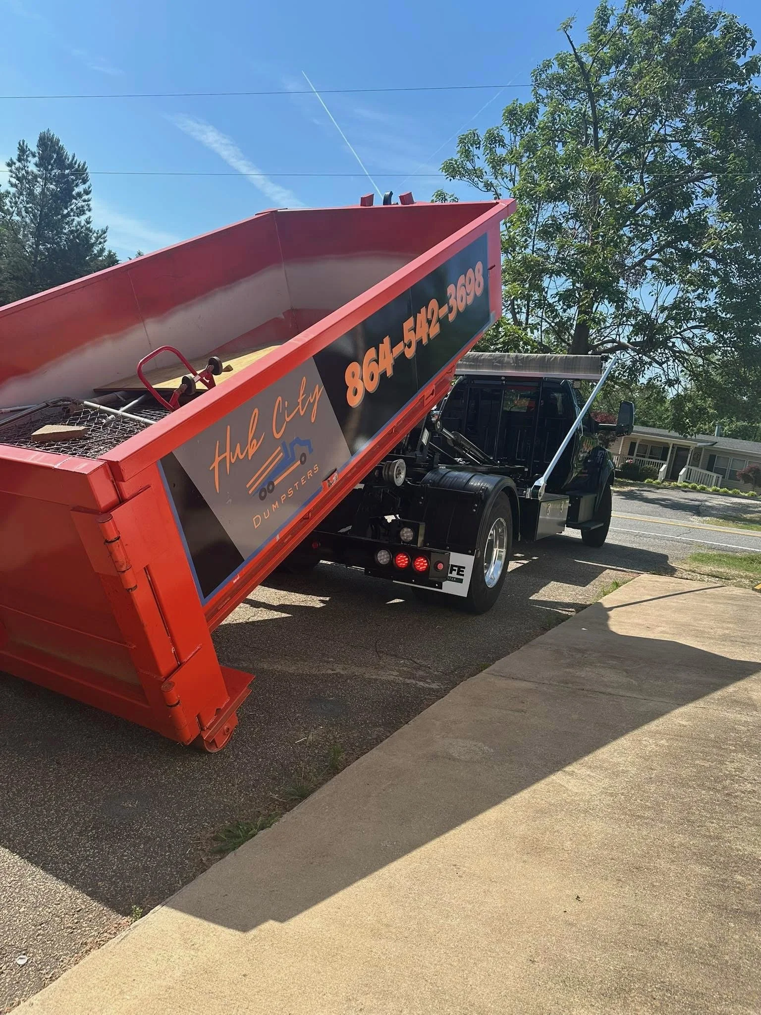 Why Driveway Protection Matters When Renting a Dumpster in Spartanburg 