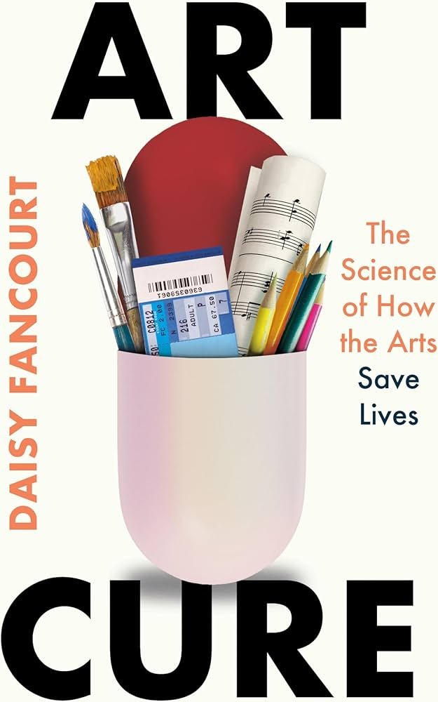 Book cover with the title "ART CURE" and the subtitle "The Science of How the Arts Save Lives." Features a white cup holding painting brushes, a ticket, sheet music, and colorful pencils.