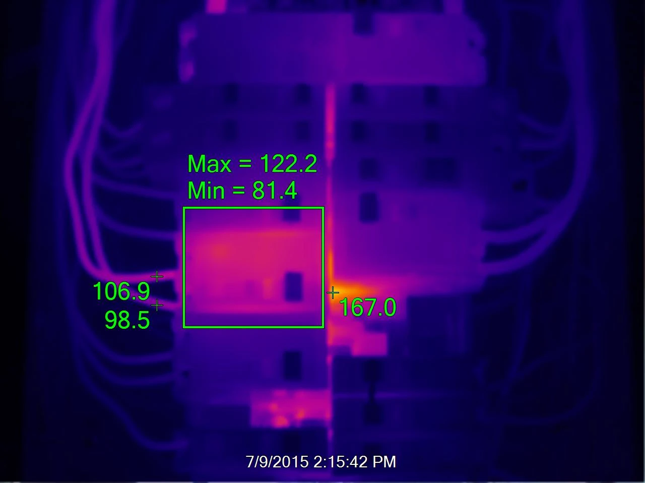 Infrared thermal image of an electronic circuit board with temperature readings. Max temperature is 122.2°F, Min is 81.4°F. Specific areas display different temperatures, with the highest around 167°F.