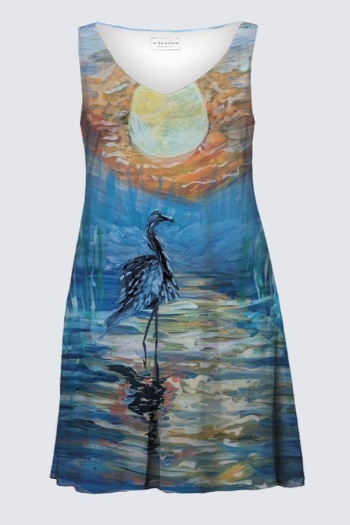 A sleeveless dress with a nature scene featuring a heron standing in water under a large sun.