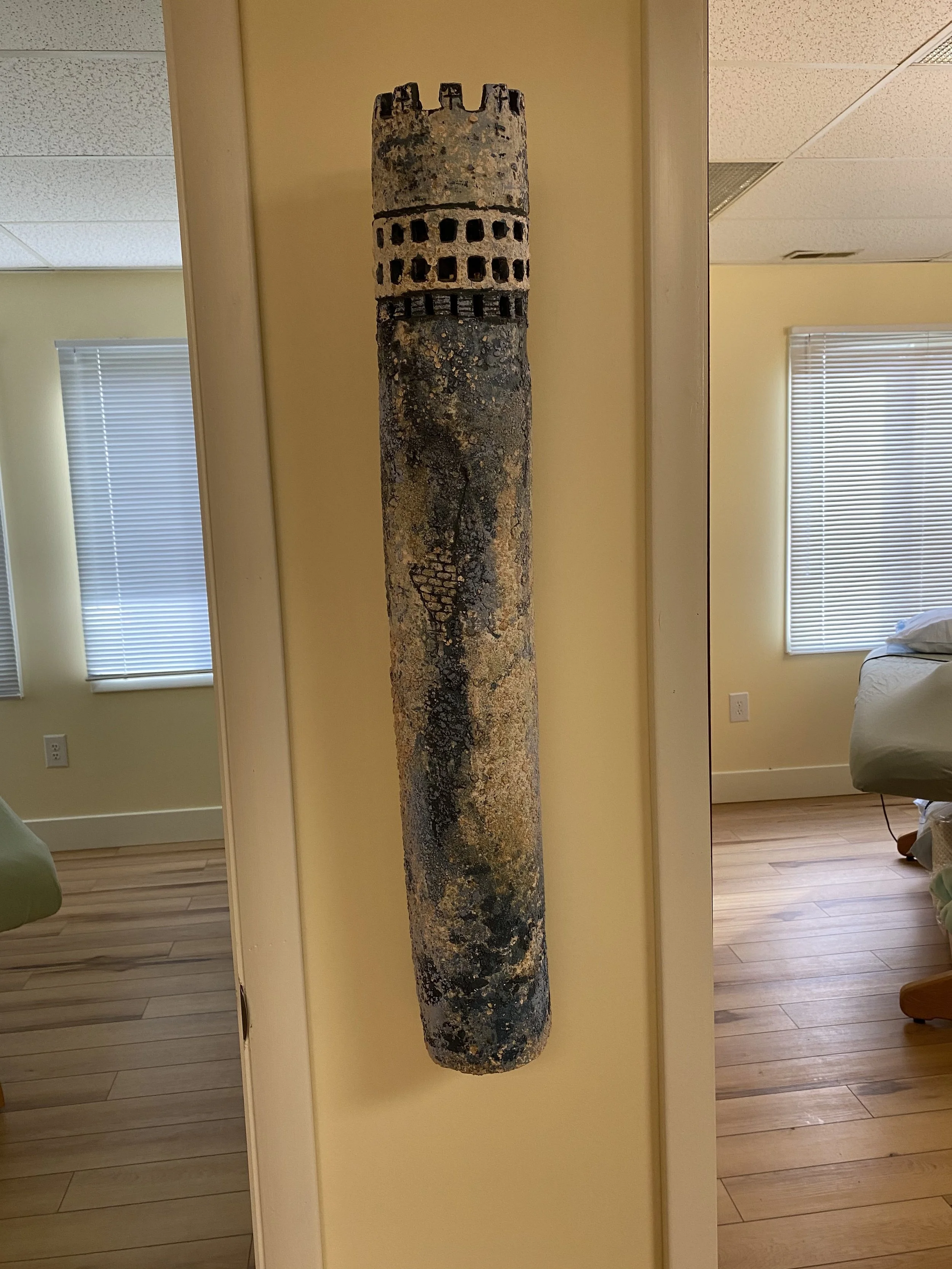  A handmade ceramic sculpture is on he wall between two treatment rooms. 