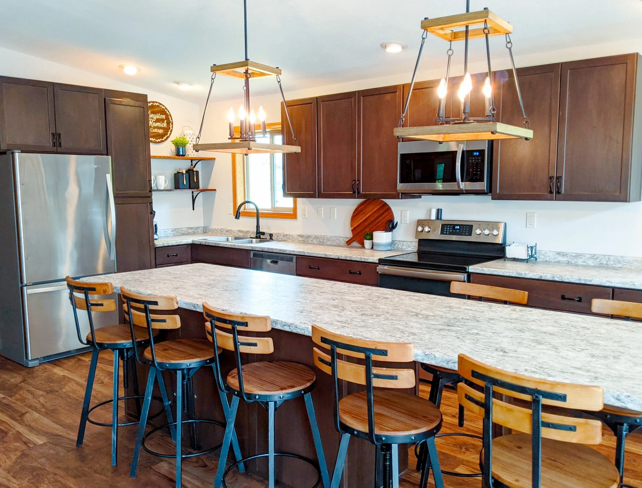 Photo of a rustic farmhouse style kitchen renovation by Revival Homes.