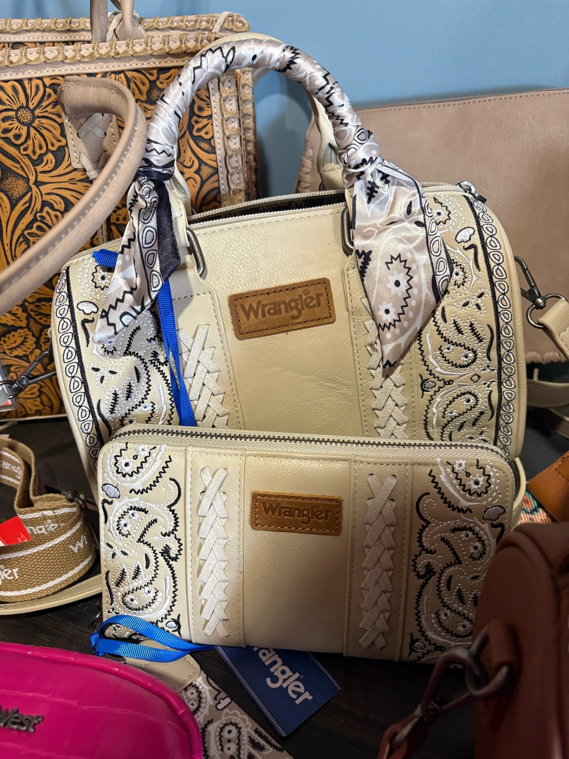 Tan Wrangler paisley print. Crossbody and wallet