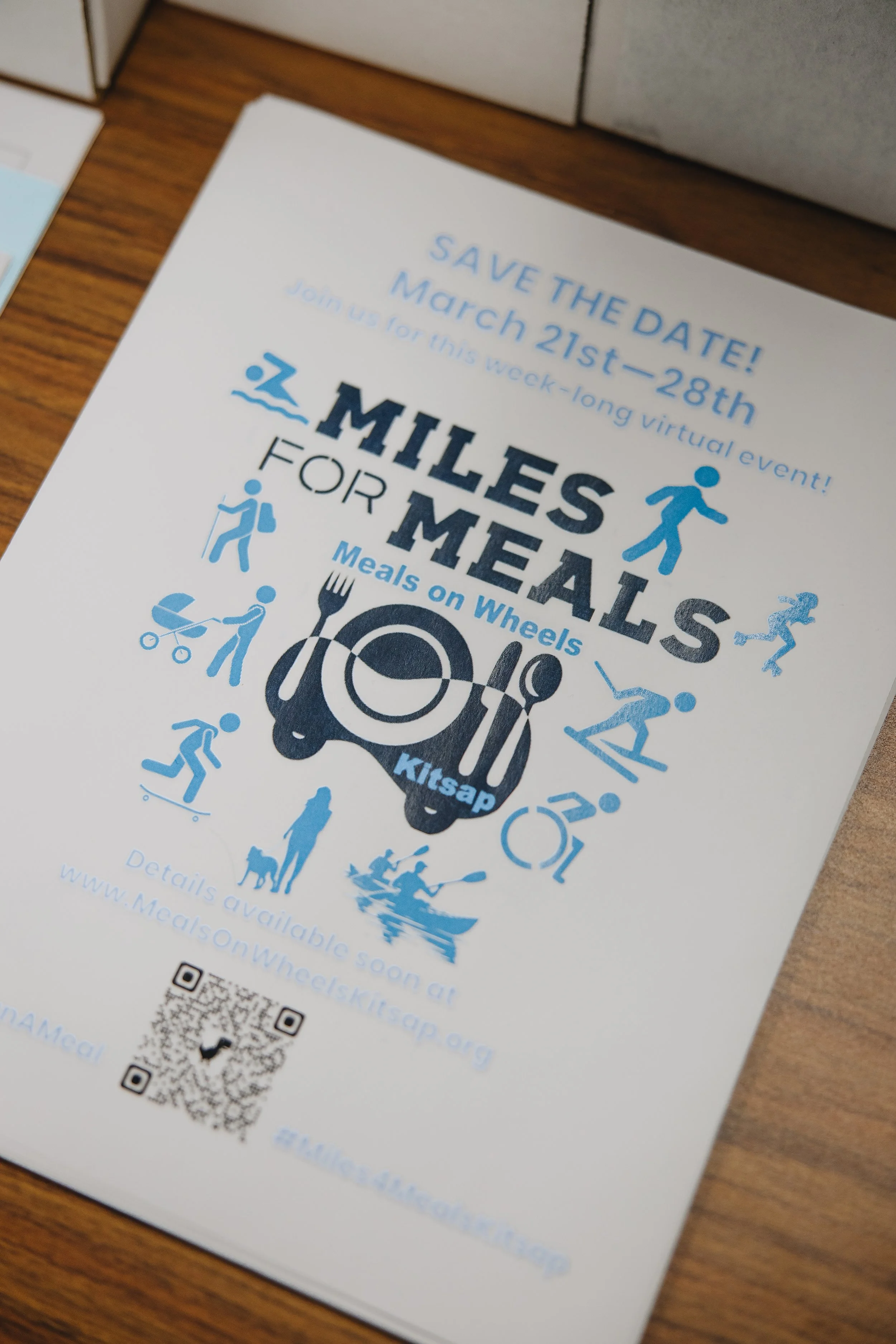 Flyer promoting 'Miles for Meals' virtual event from March 21-28, featuring icons of exercise including walking, running, biking, kayaking, and skateboarding, as well as a fork, knife, and plate with the event logo 'Kitnap'.