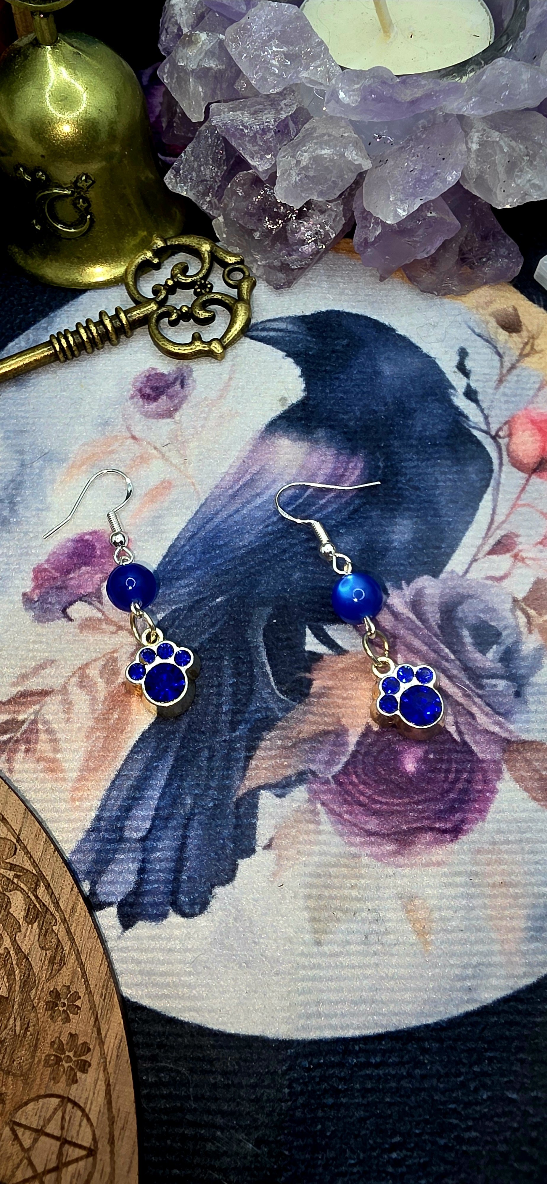 Silver Paw Earring with Dark Blue Gems